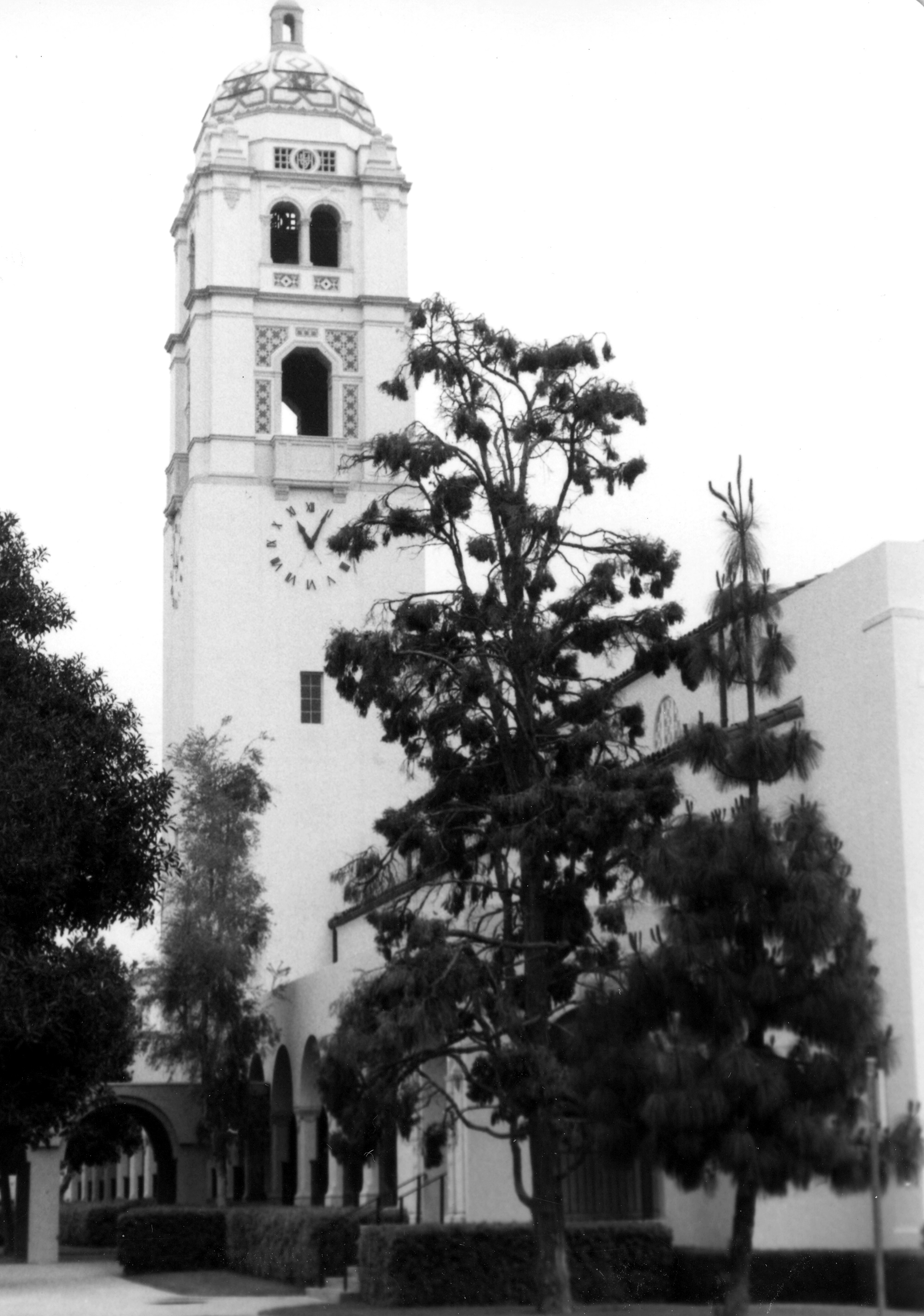 A black and white photograph of the clock tower at the Fullerton Union High School Auditorium.