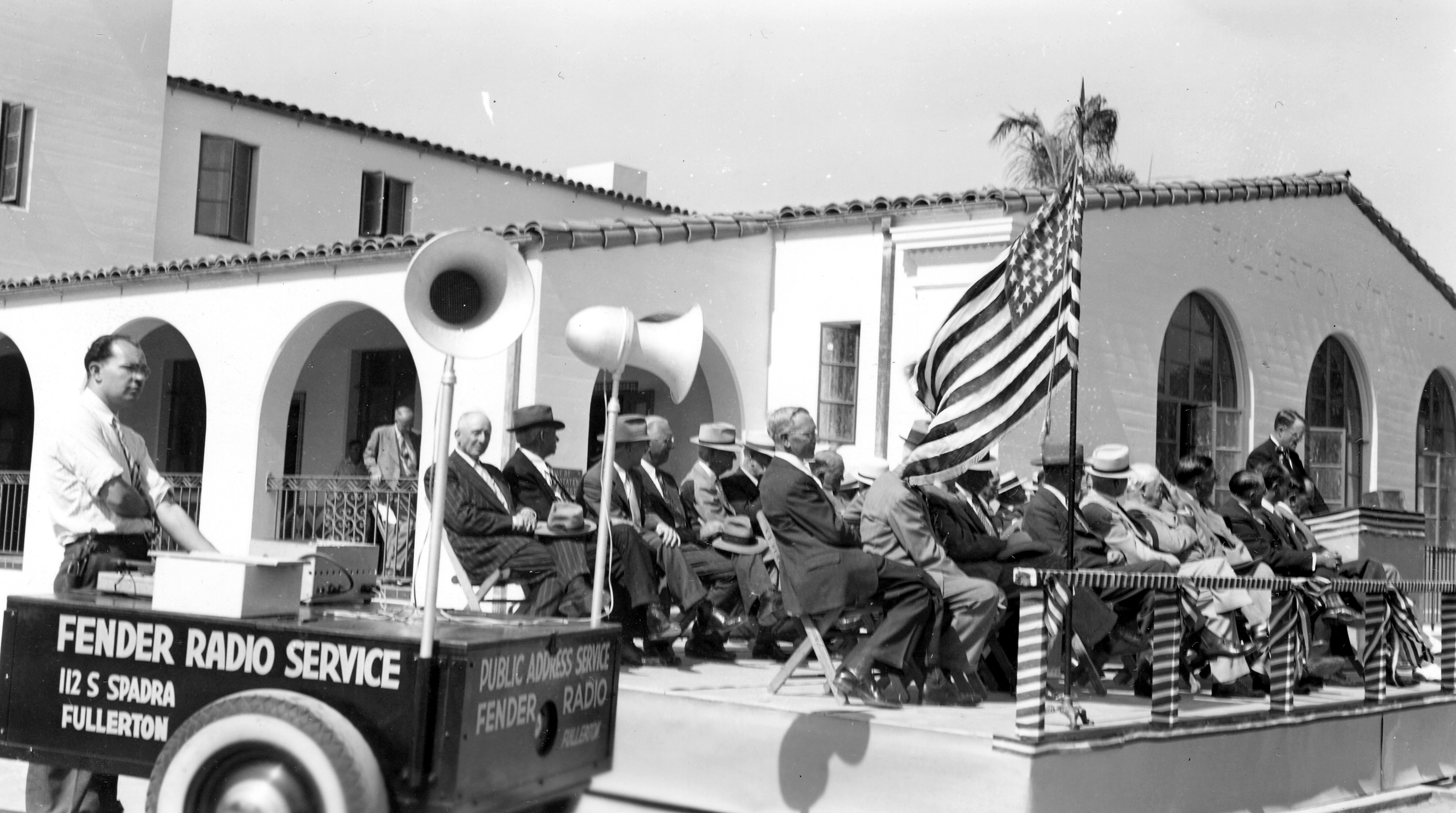 A black and white photograph of the Cornerstone Ceremony taking place at Fullerton City Hall in 1941.
