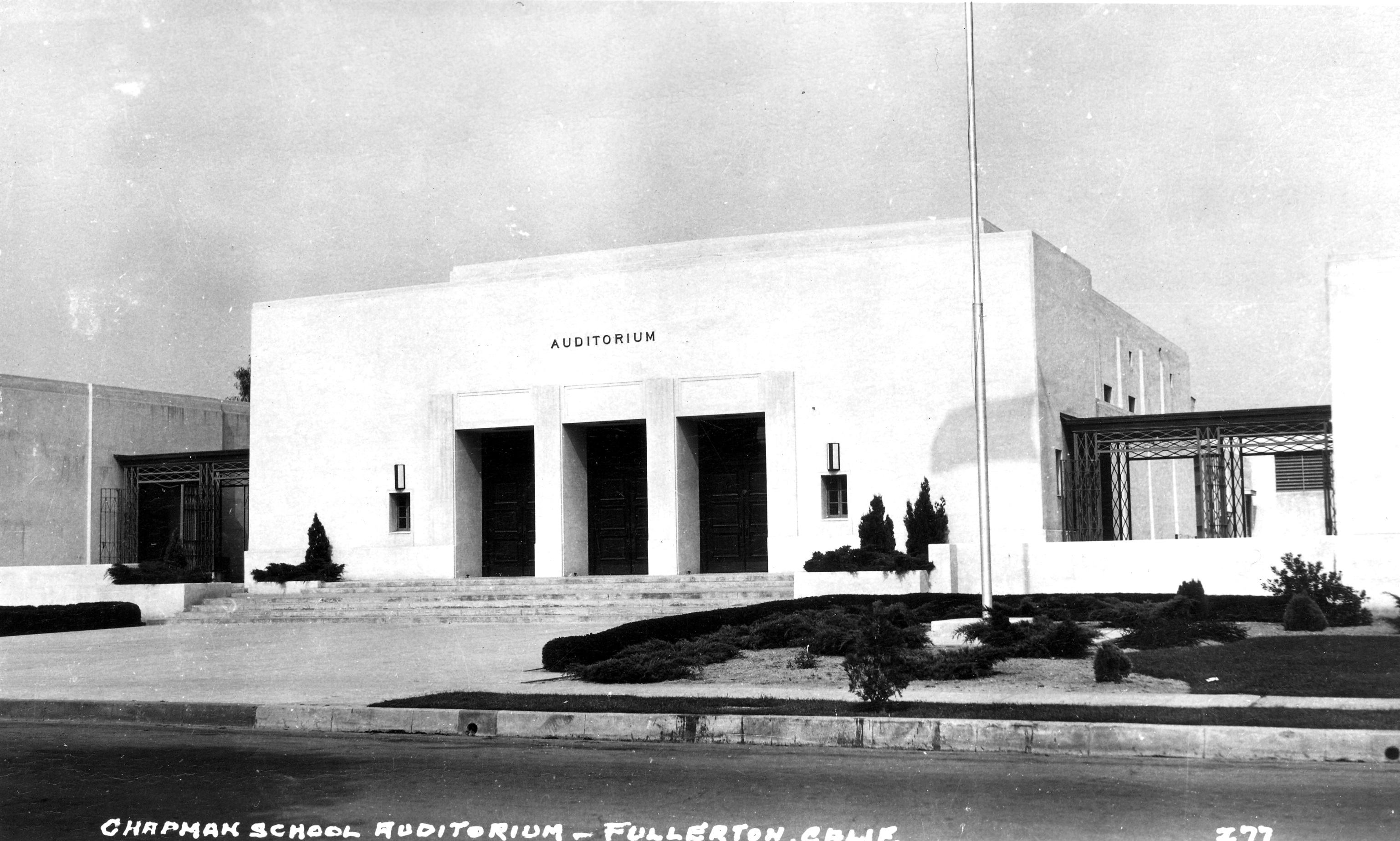 A black and white photograph of the early exterior of Wilshire Auditorium.