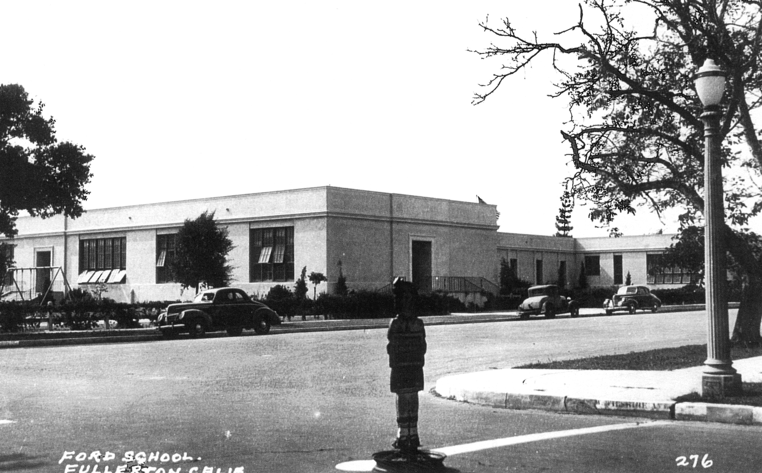 A black and white photograph of the exterior of Ford Elementary School from Wilshire Ave circa 1930s.