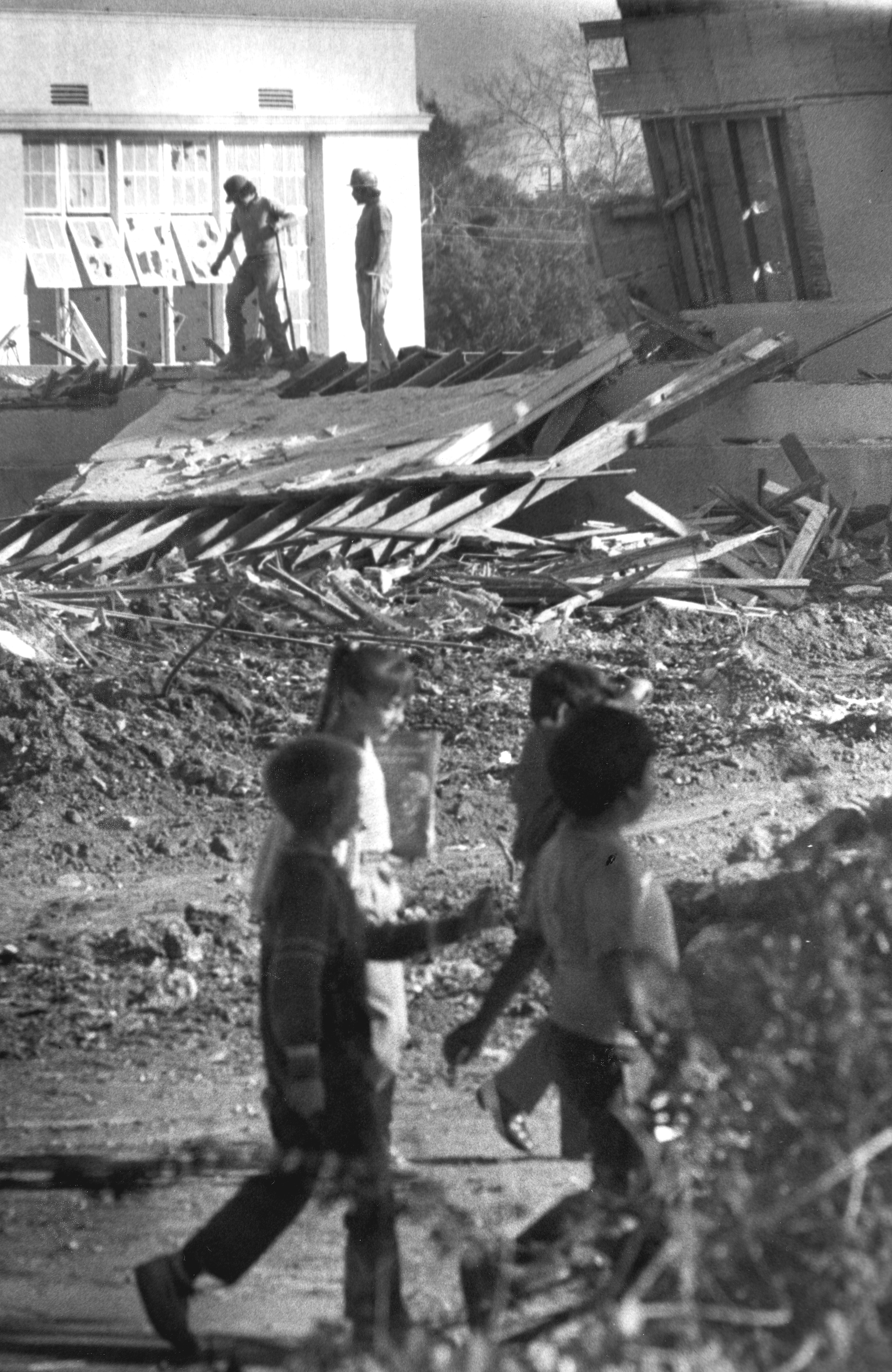 A black and white photograph of the demolition of Ford Elementary School in 1984.