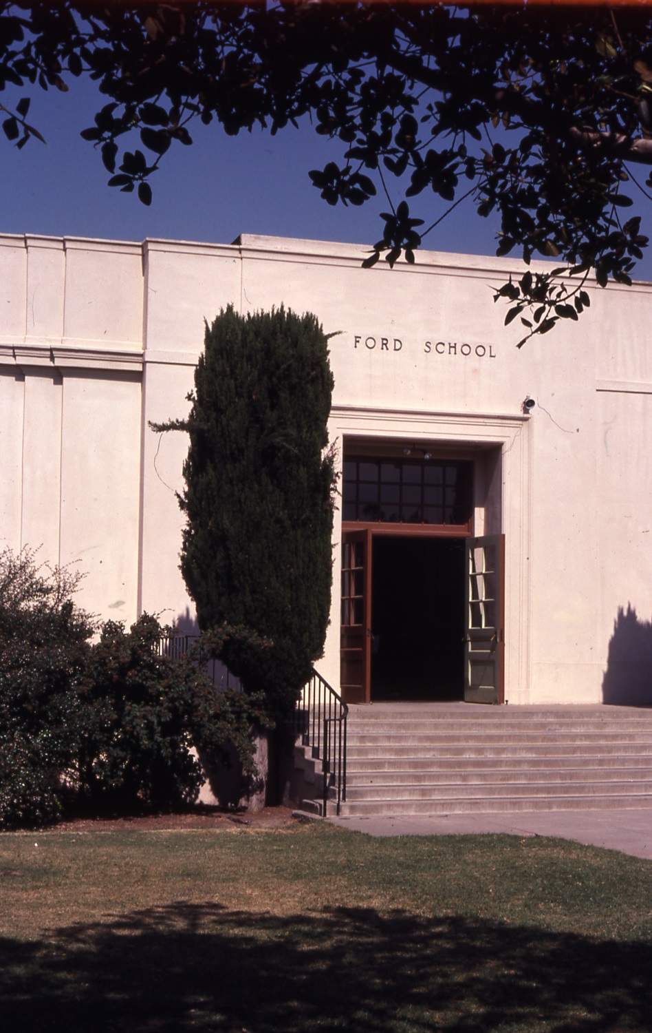 A colored photo of the school entrance of Ford Elementary School in 1979.