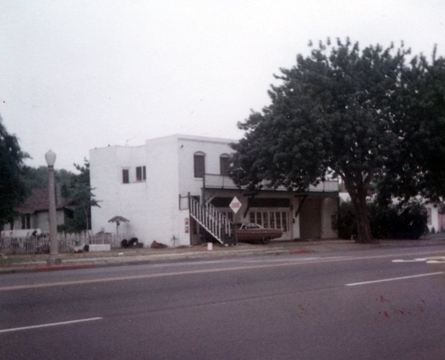 A colored photo of the street view of Loumagne&#039;s Market in 1973