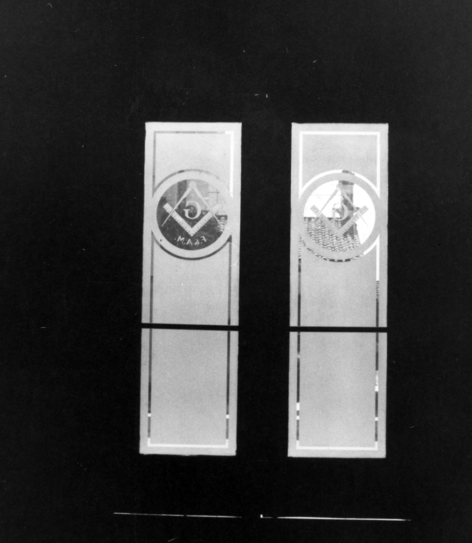 A black and white photograph of the second Masonic Temple&#039;s front doors in 1994 before renovation.