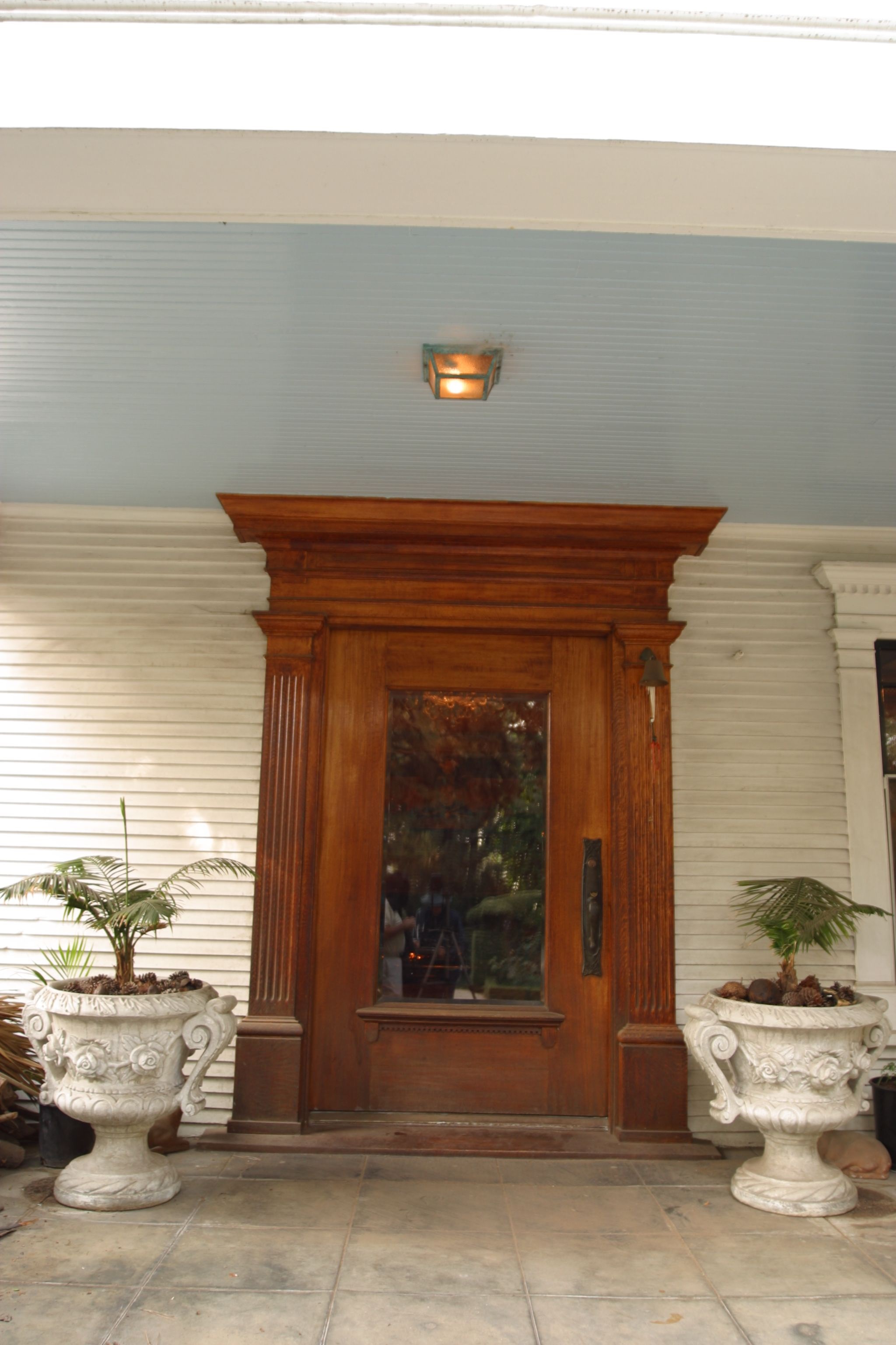 A colored photo of the front door entrance of the Pierotti House &amp; Gardens in 2006.