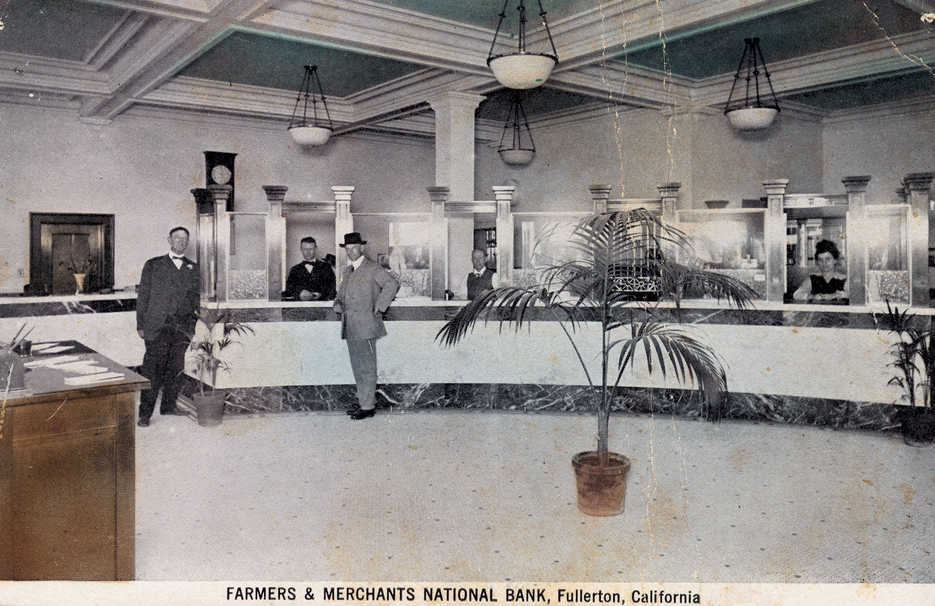 A colored photo of the interior of the Farmers and Merchants Bank. The bottom of the photo reads: FARMERS &amp; MERCHANTS NATIONAL BANK, Fullerton, California.