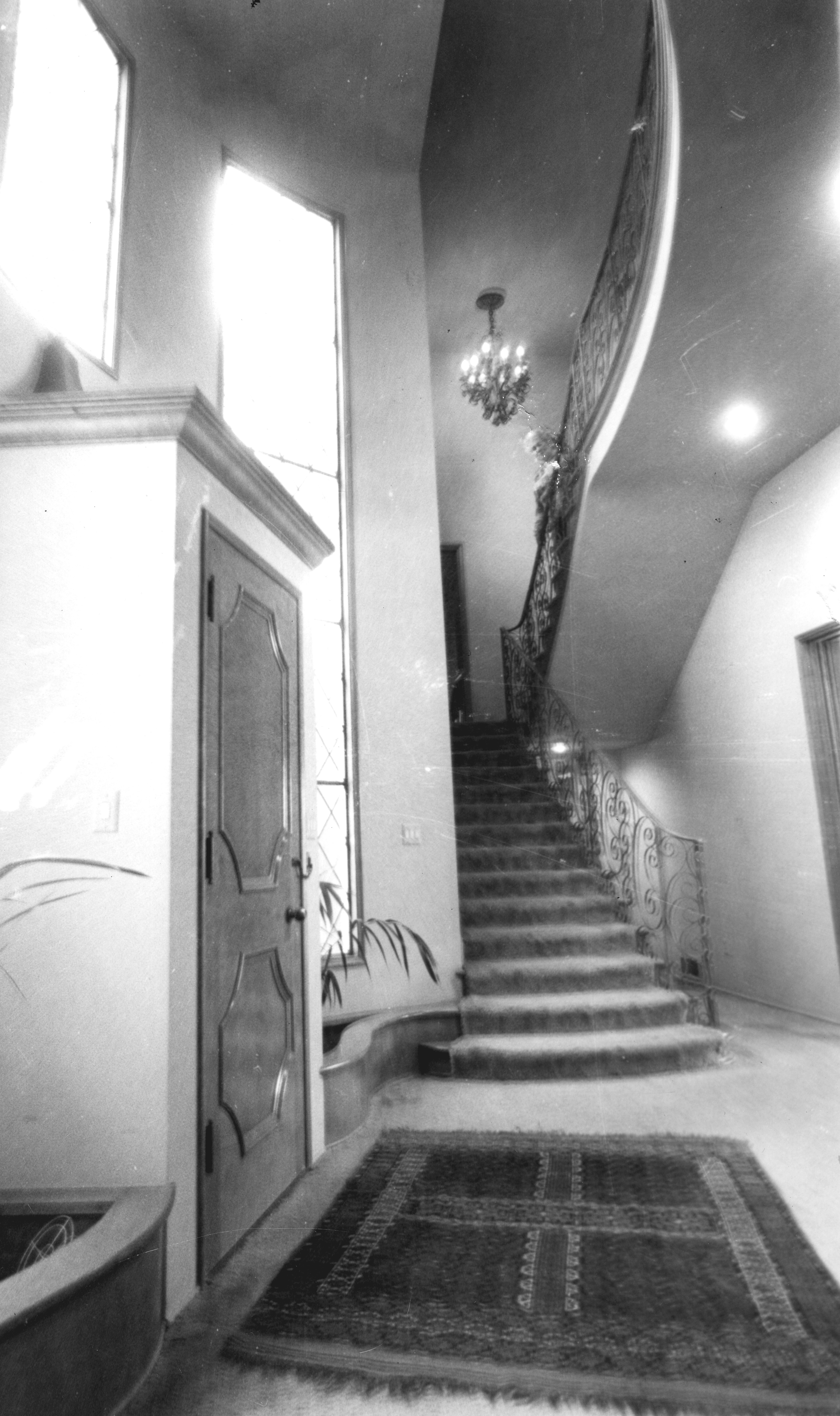 A black and white photograph of the interior staircase inside the El Dorado Ranch in 1984.