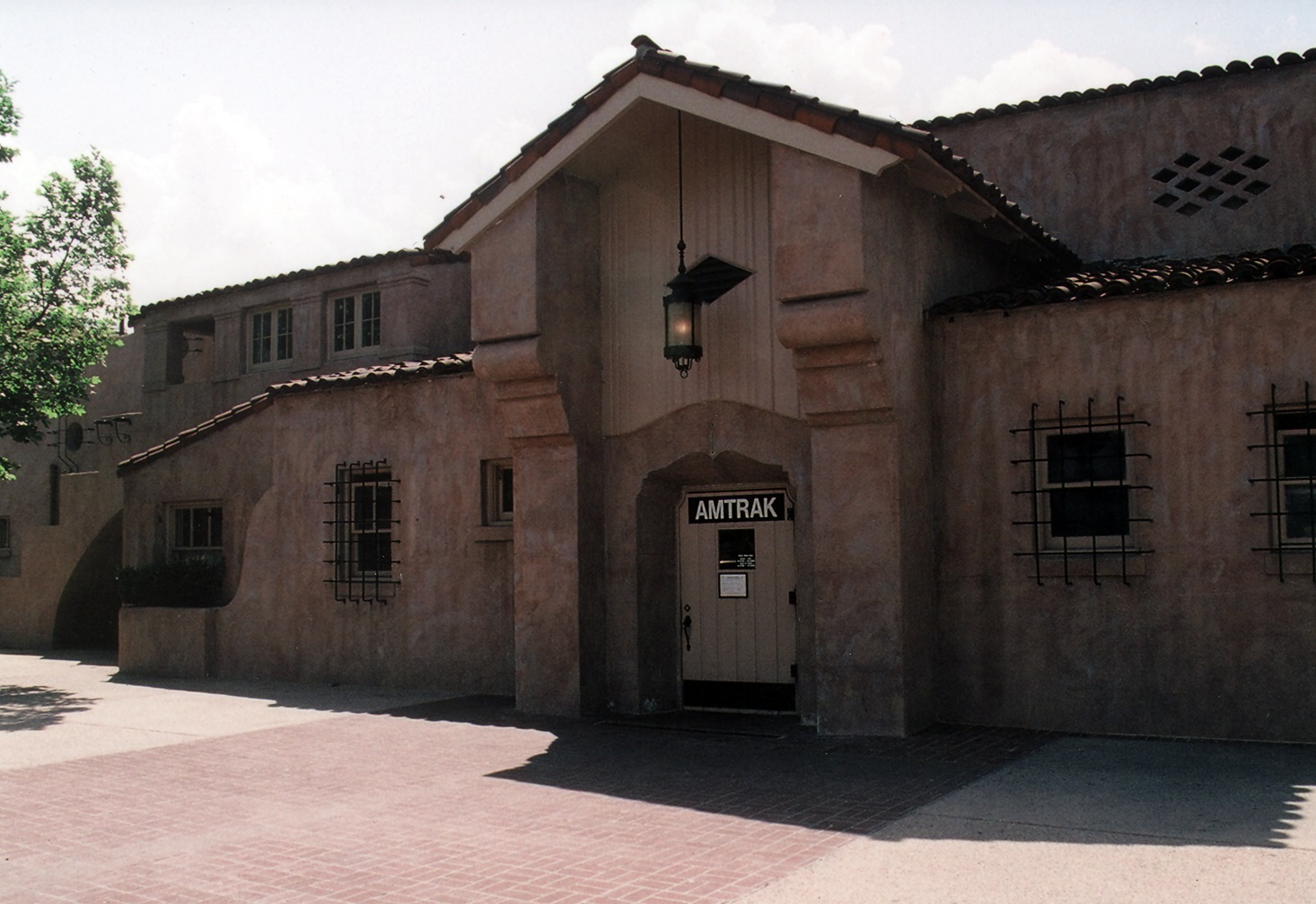 A colored photo of the north side of the Santa Fe Railway Passenger &amp; Freight Depot in 2021.