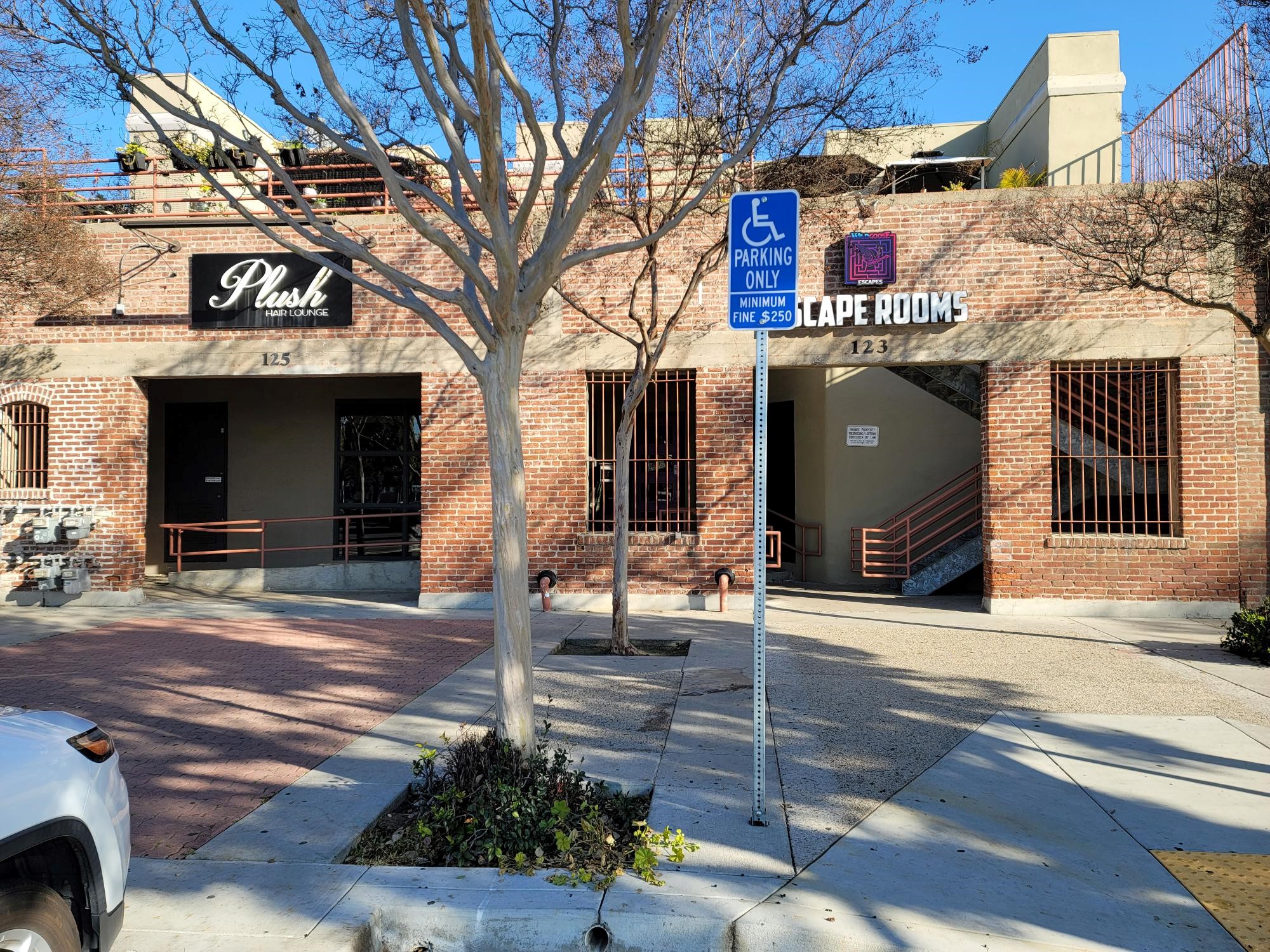 A colored photo of the rear of the original brick building in 2025 of the Fullerton Building &amp; Loan Association.