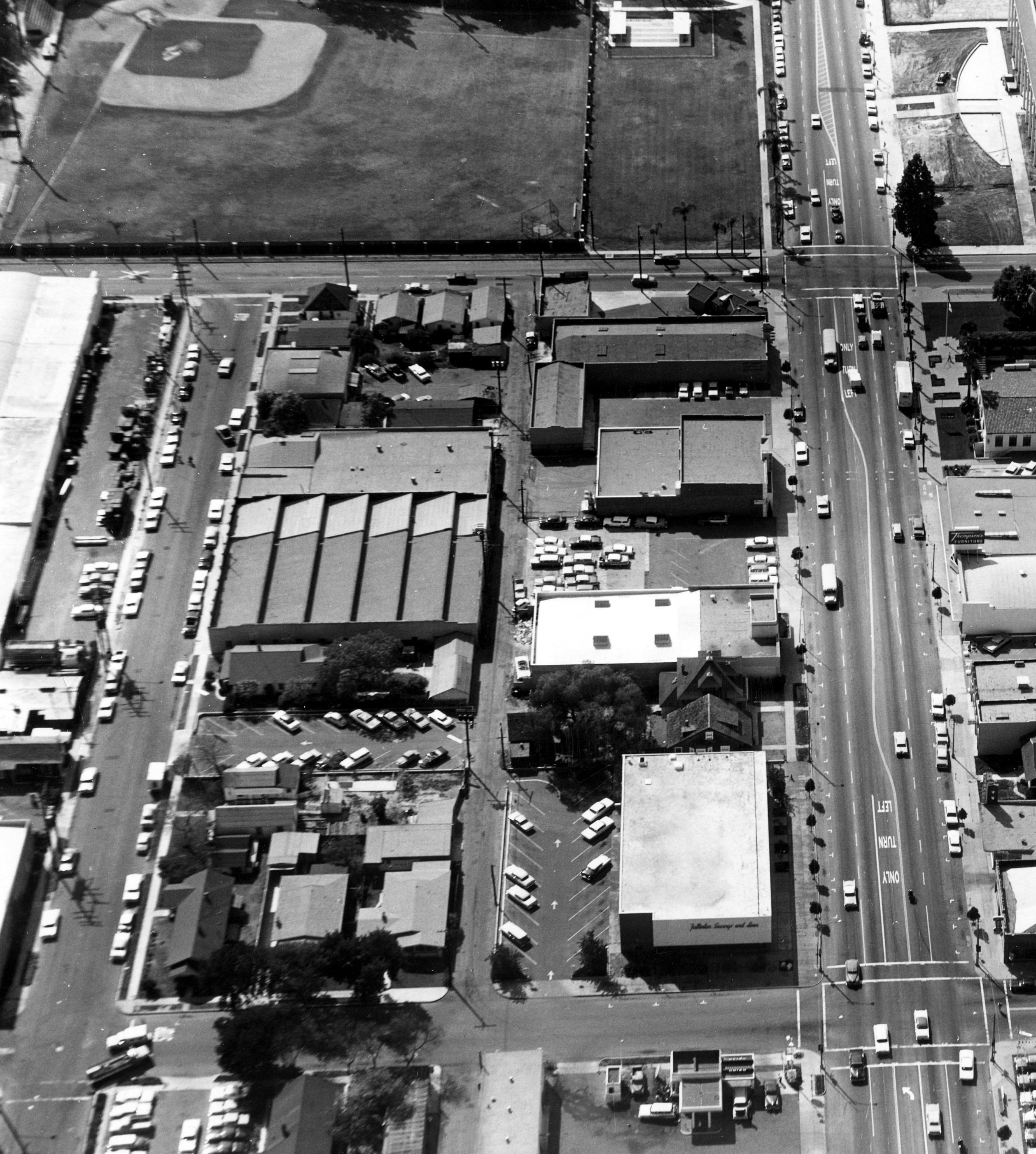 A black and white photograph of the aerial view above the Sanitary Laundry Building and Fullerton Dye Works building in 1963.