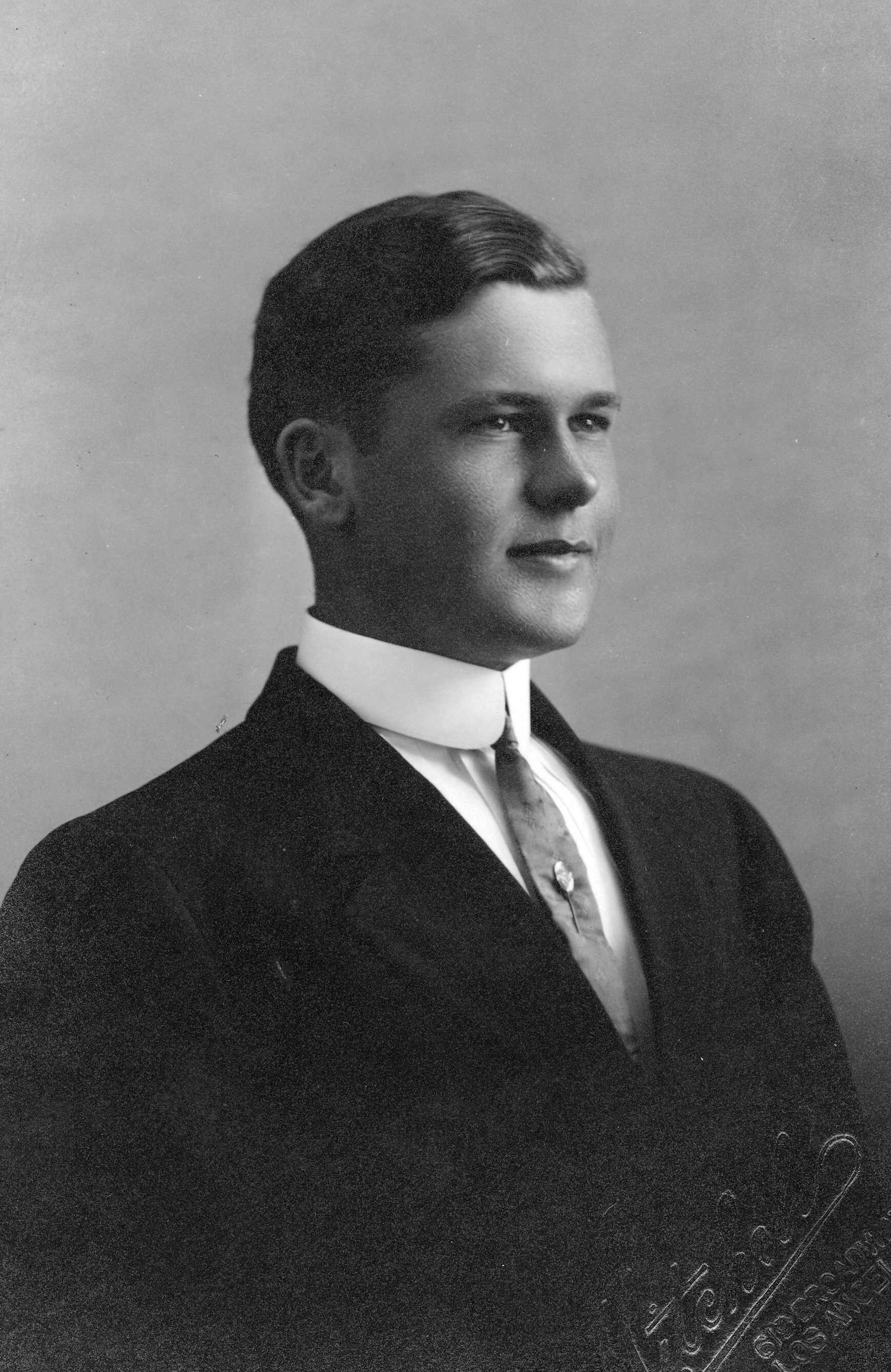 A black and white portrait photograph of Arthur Kelley.
