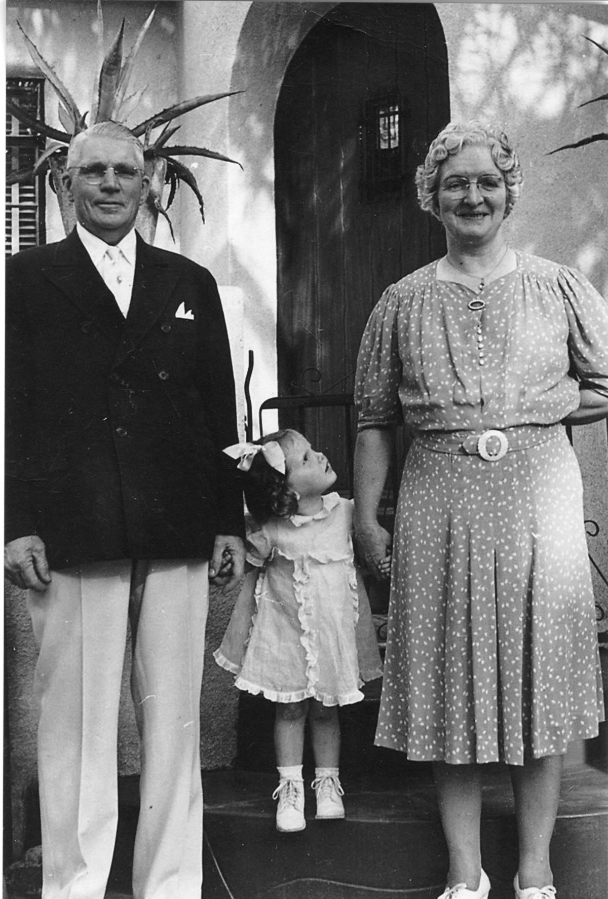 A black and white photograph of three members of the Bruns Family.
