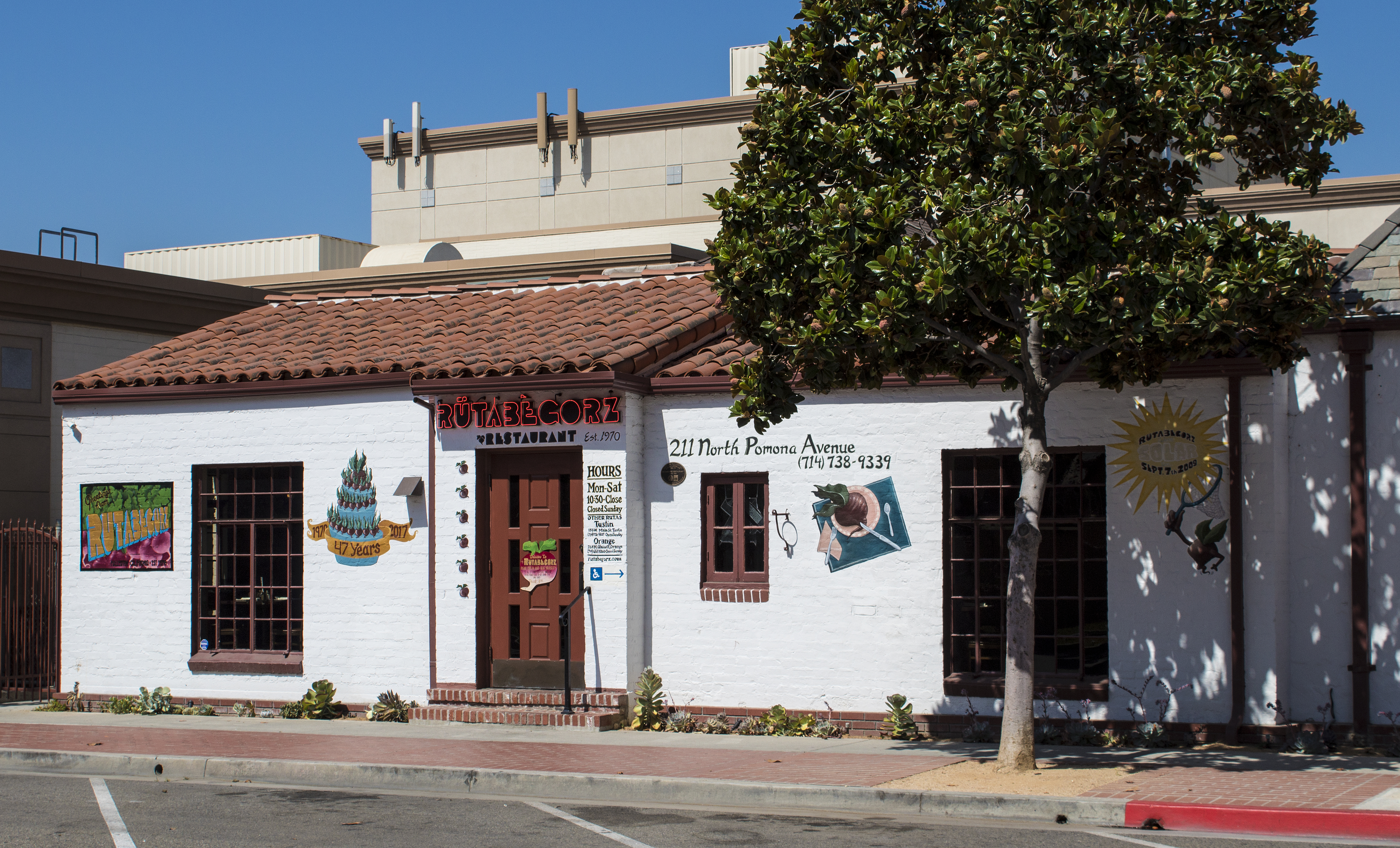 A colored photo of the Dr. Olson Home &amp; Medical Office (now Rutabegorz Restaurant) in 2017.