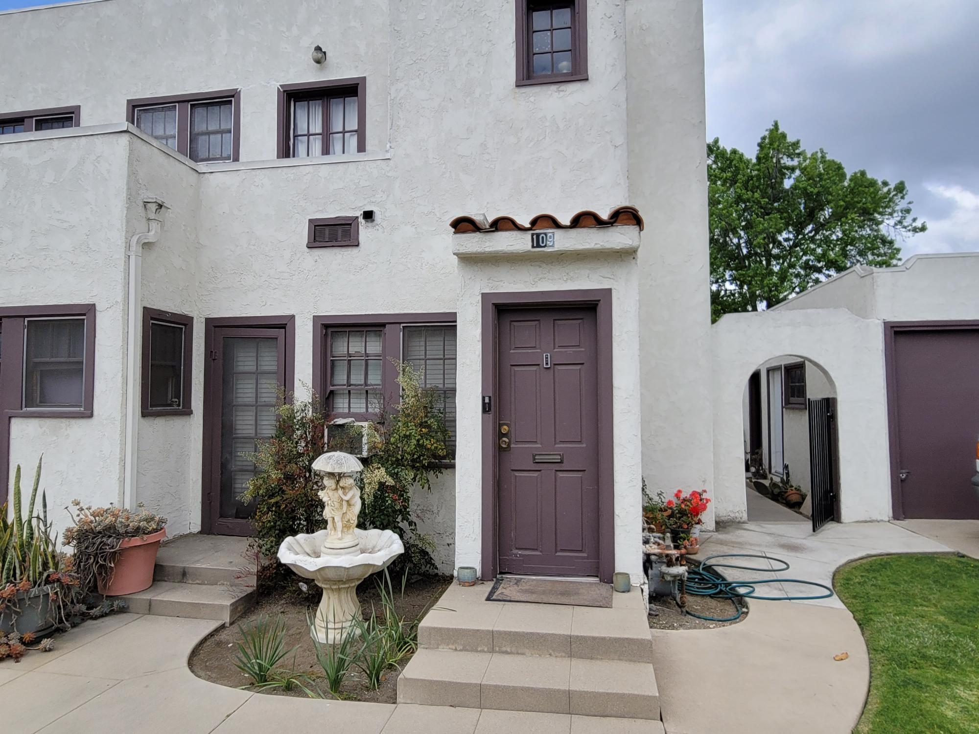 A colored photo of the east side unit entrance of the Jesse Ellis Apartments in 2025.