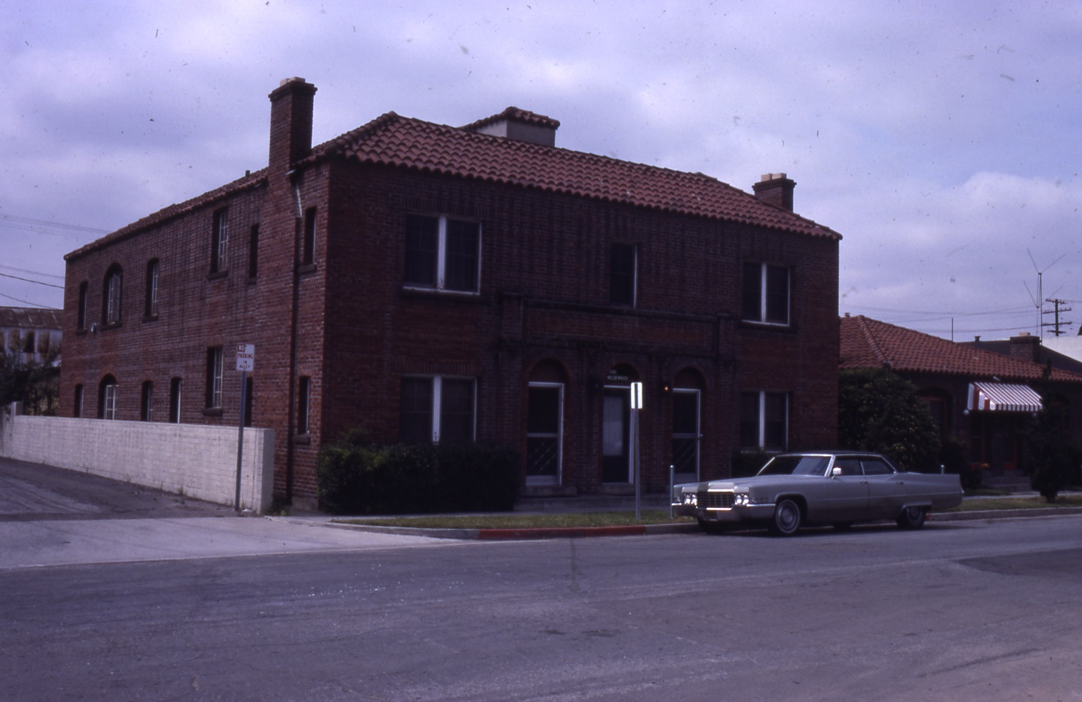 A colored photo of the exterior of the Samuel Dunphy Apartments (now Westwood Apartments) in 1982.