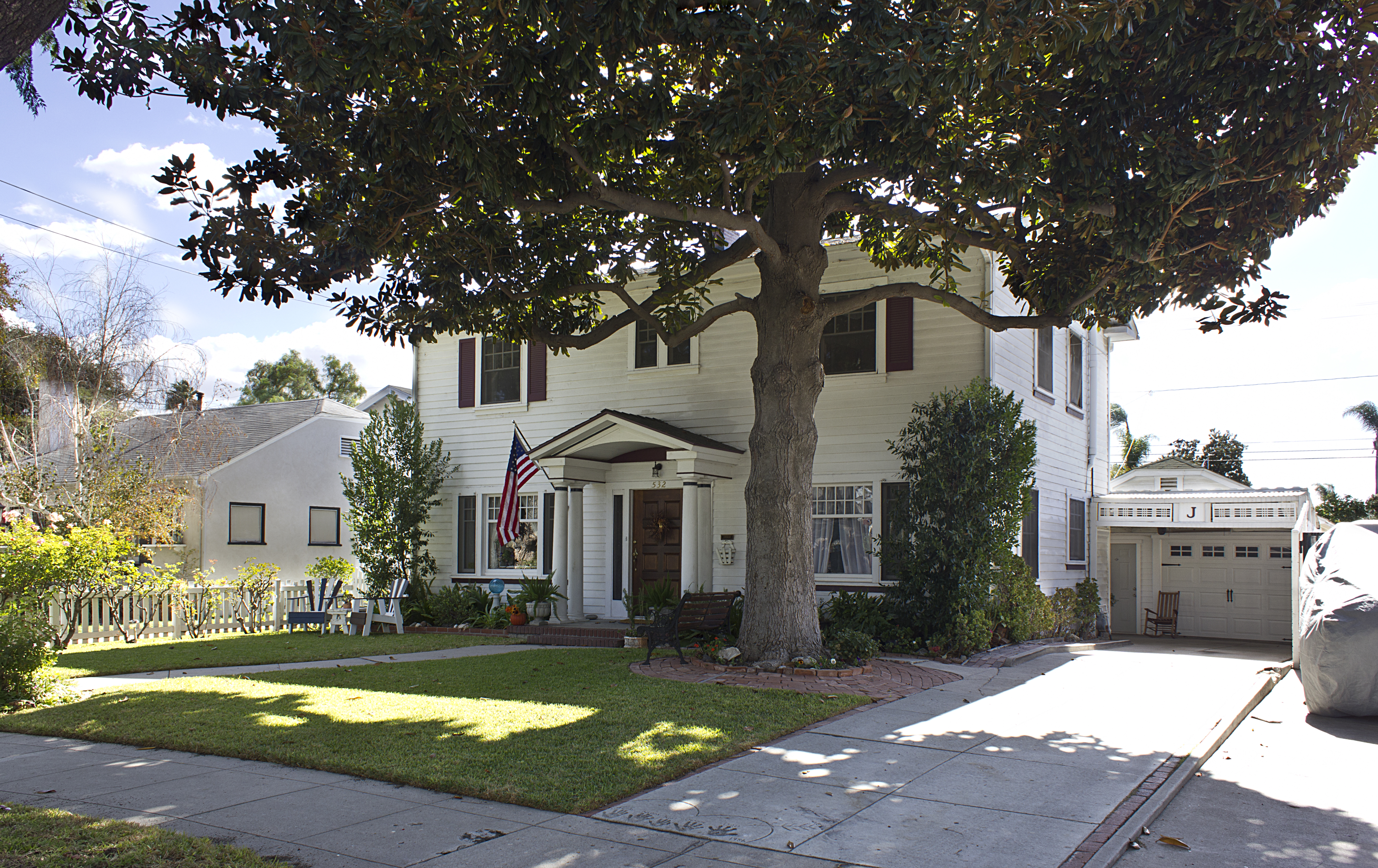 A colored photo of the exterior of the Joseph Mennes House in 2012.