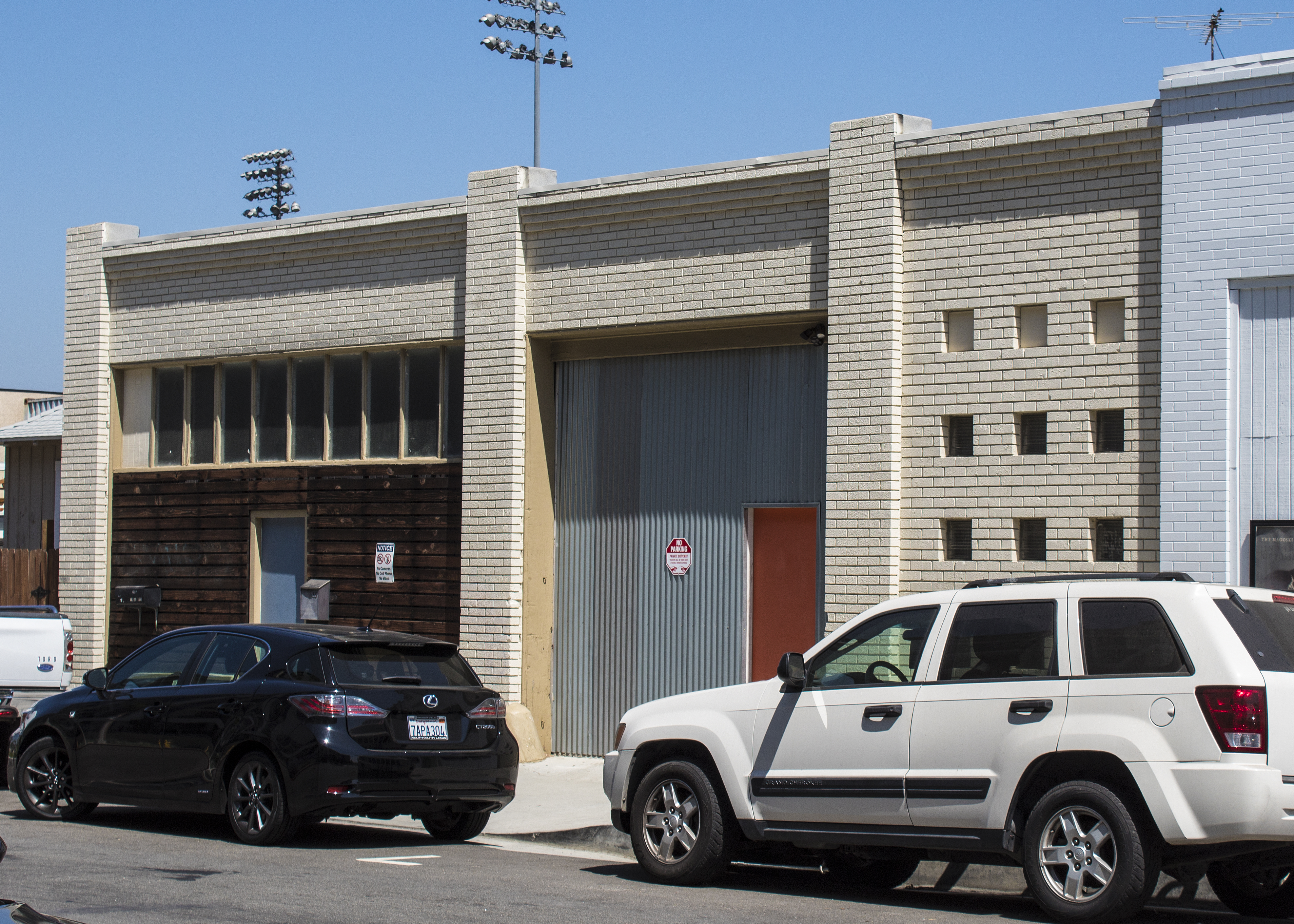 A colored photo of the exterior detail of the Fullerton Dye Works building in 2017.