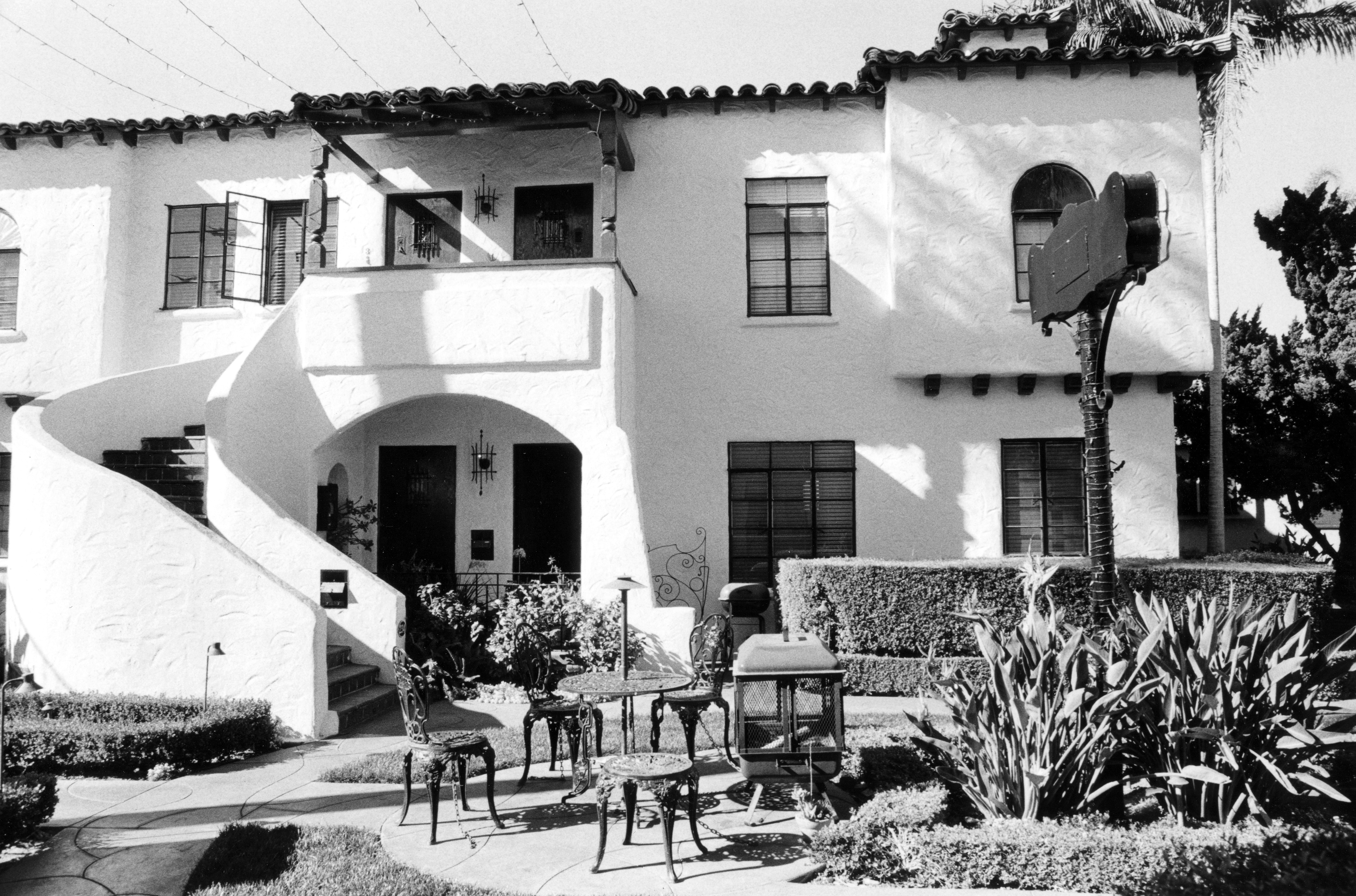 A black and white photograph of the exterior of the Dewella Apartments facing west in 2008.