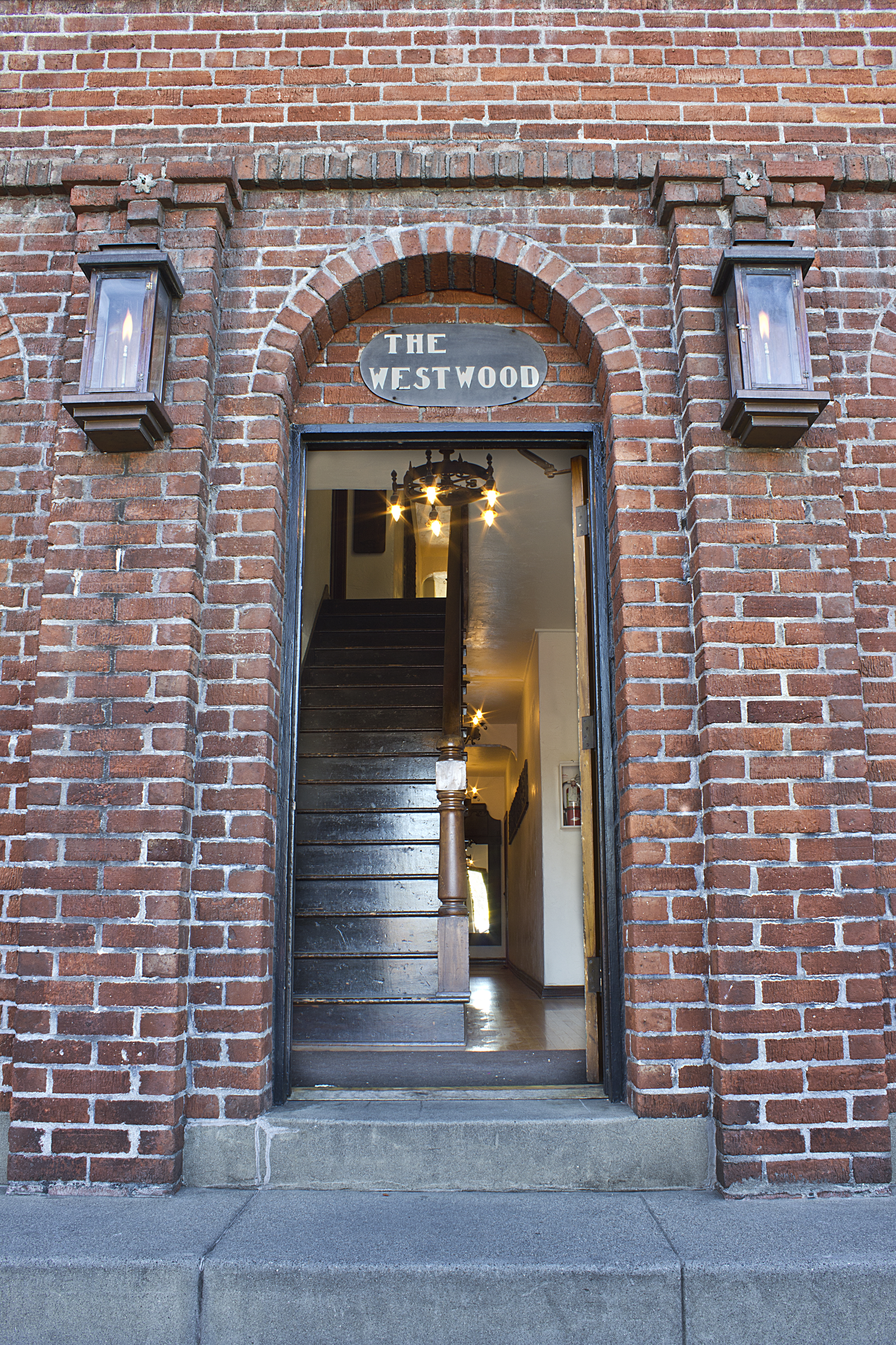 A colored photo of the front entrance of the Samuel Dunphy Apartments (now Westwood Apartments) in 2012.