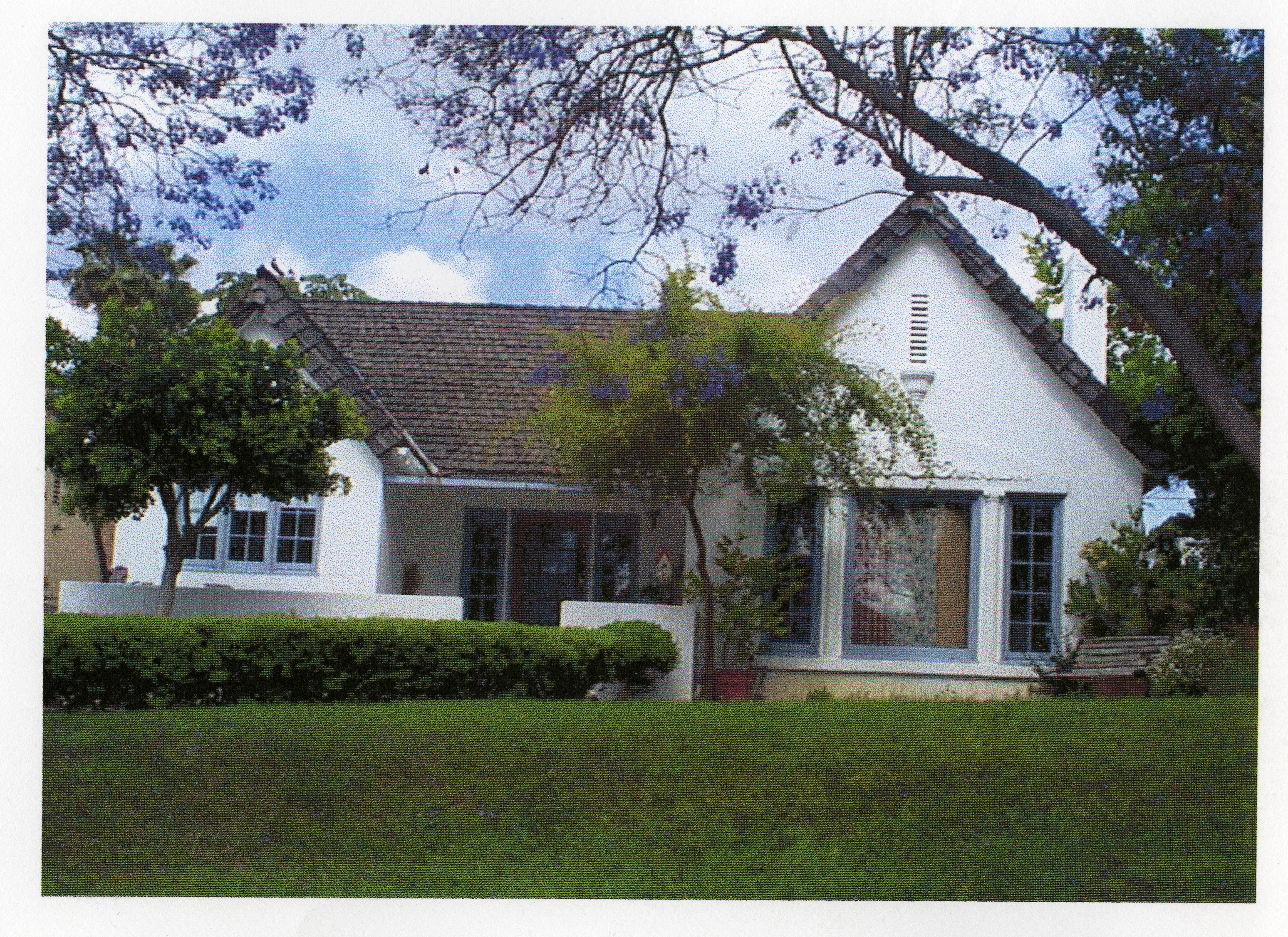 A colored photo of the Clinton Abbott House for Fullerton Through the Years in 2000.