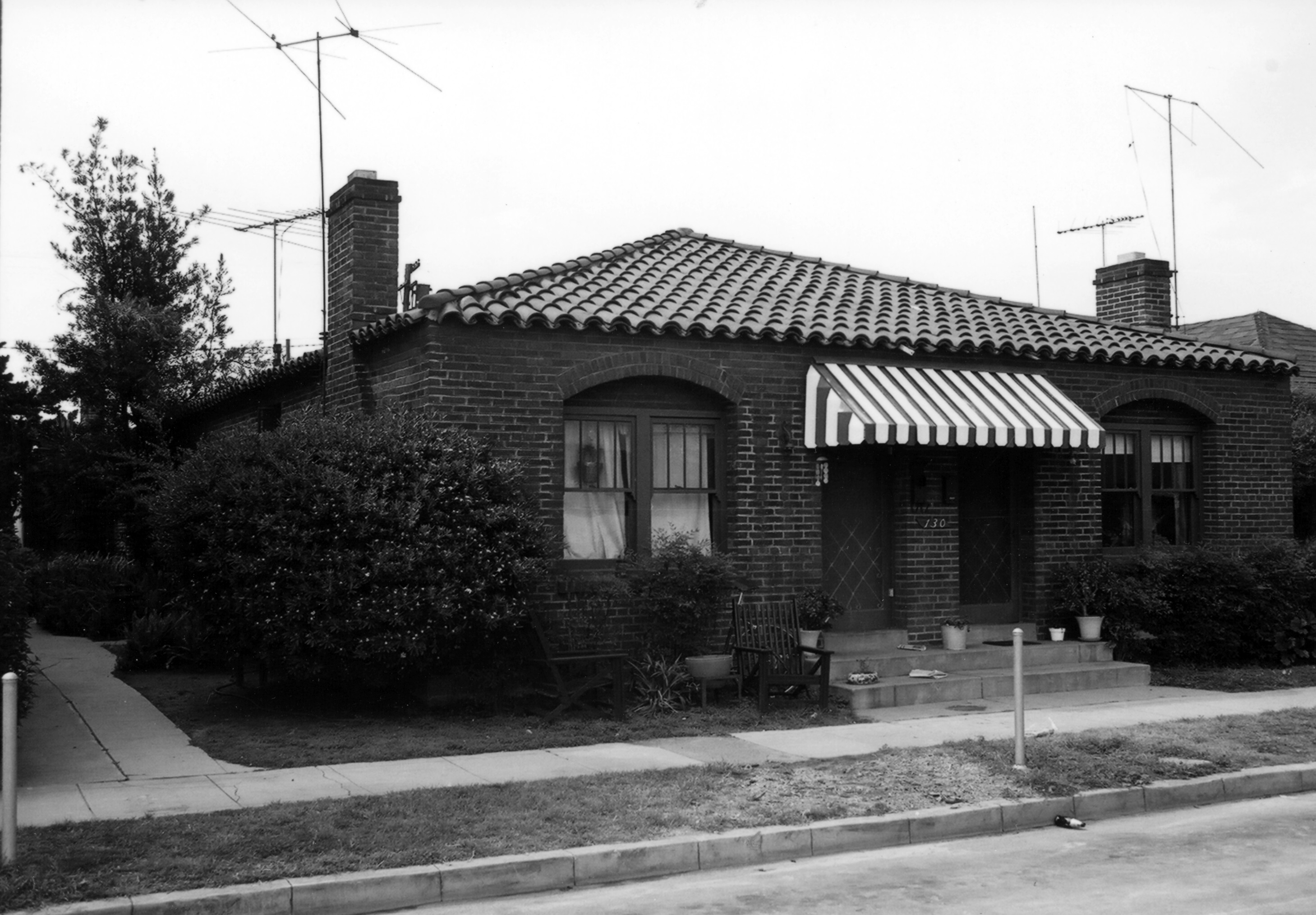 A black and white photograph of the Samuel Dunphy Fourplex (now Westwood Apartments) for the Historical Building Survey in 1978.