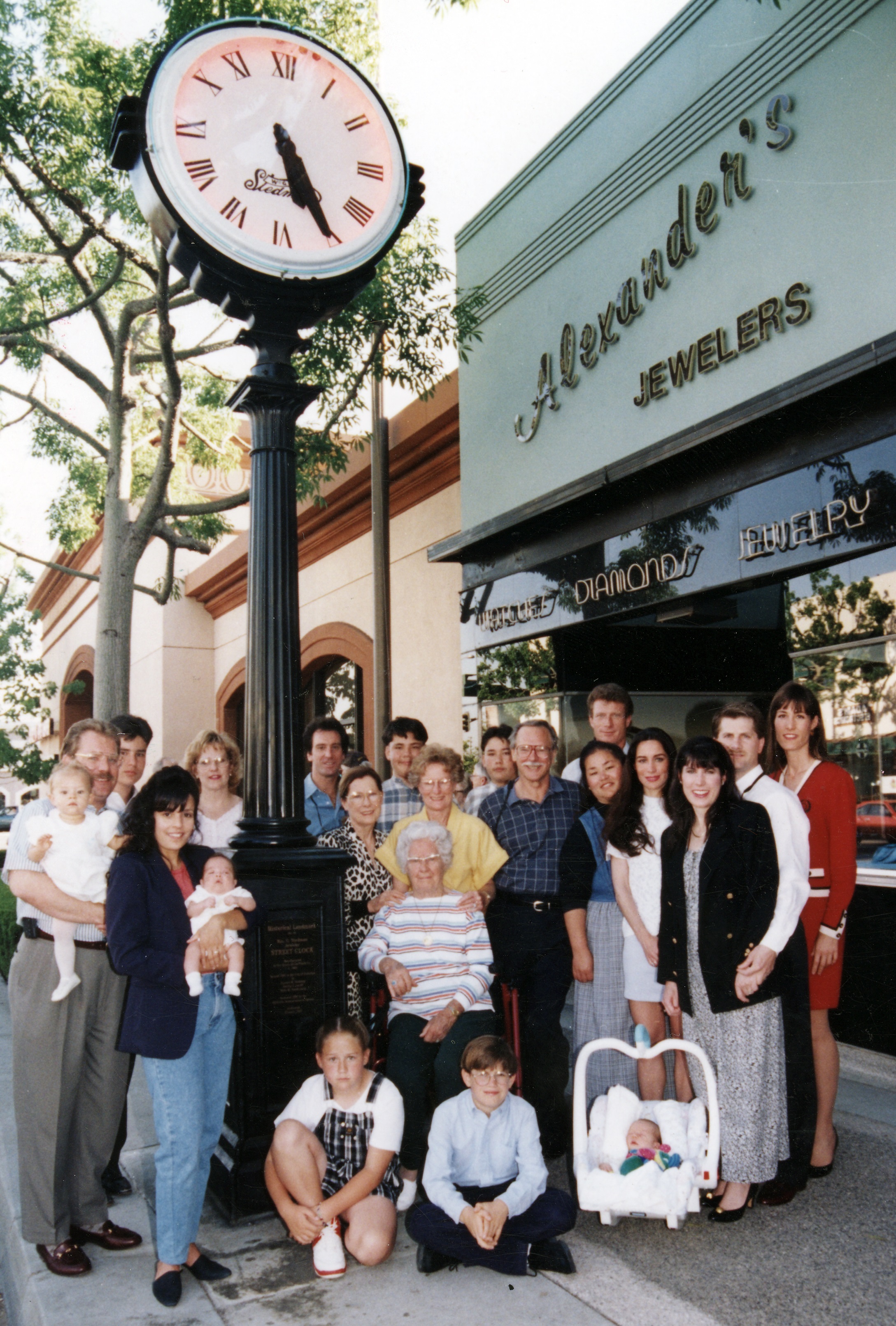 A colored photo of the Stedman family at the 1997 plaque ceremony for the Stedman Jewelers&#039; Clock.