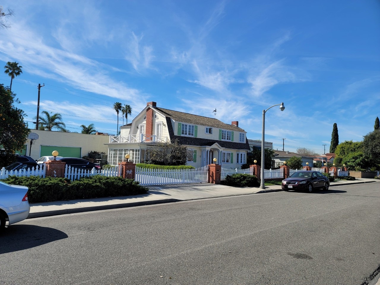 A colored photo of the street scene of the Max Royer House in 2022.