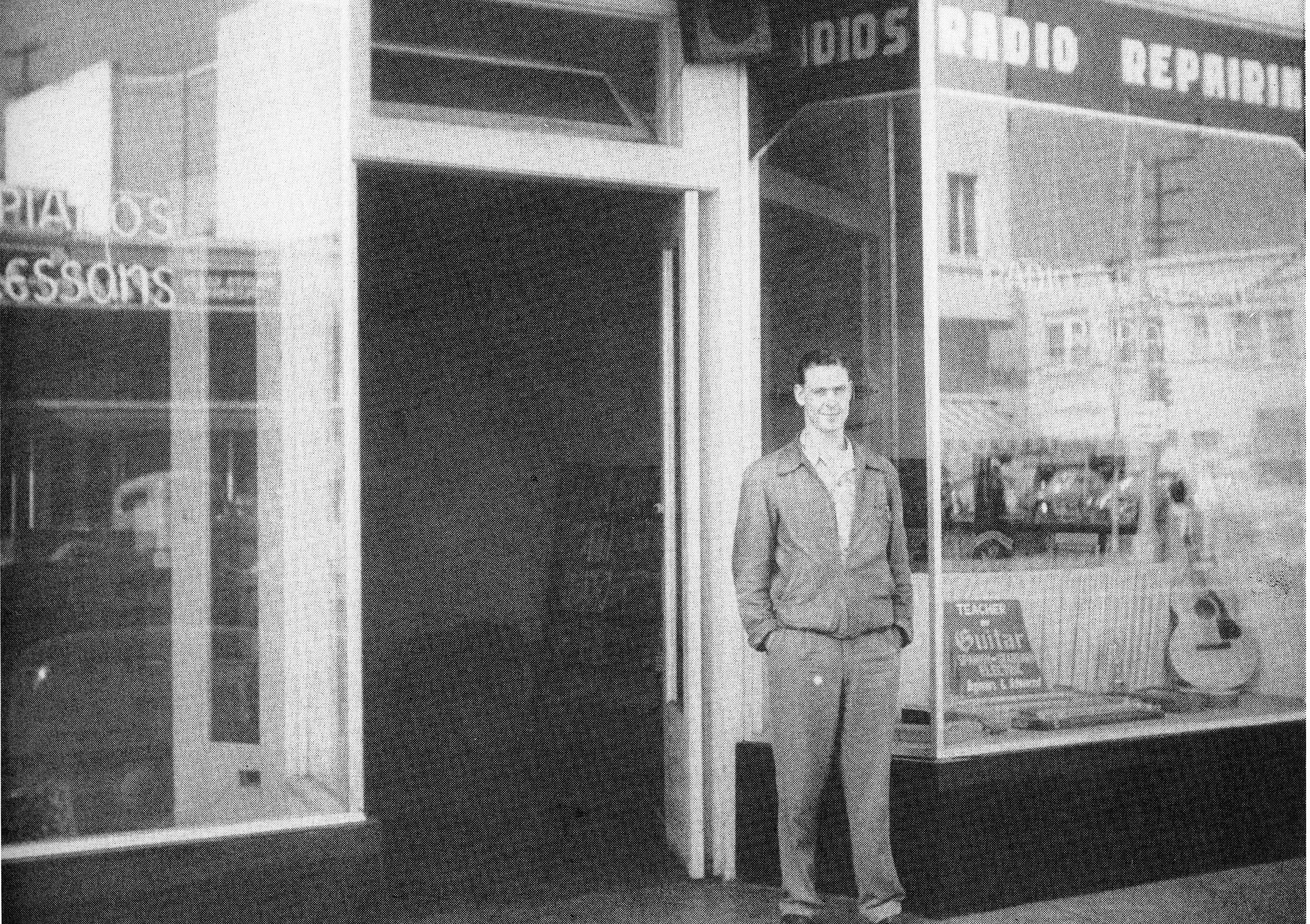 A black and white photograph of the shop entrance for Leo Fender Radio Shop in 1949.