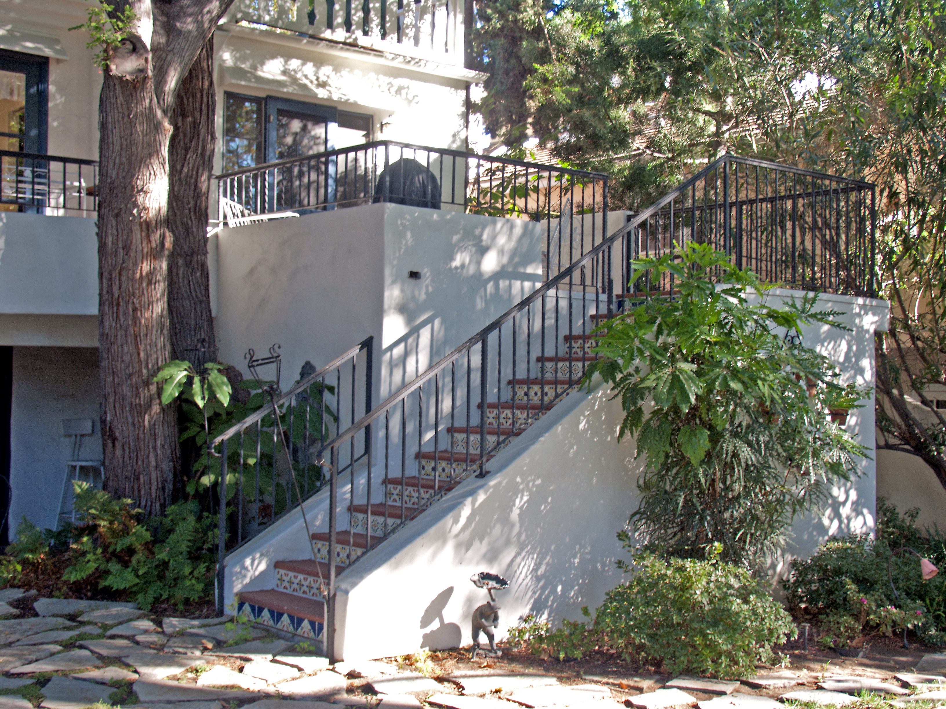 A colored photo of the stairs leading to the backyard of the Jesse Swearingen House in 2012.