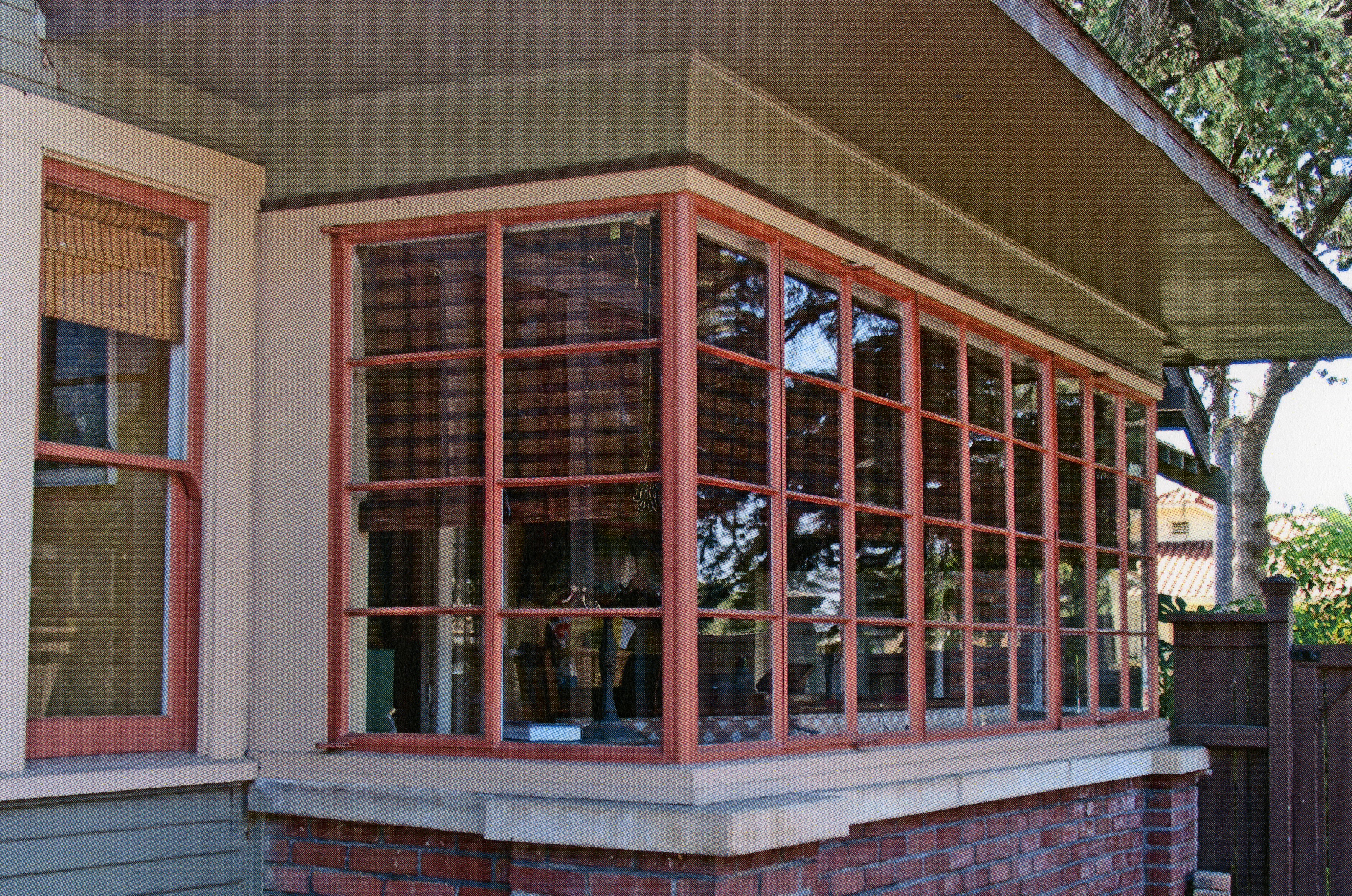 A colored photo of the enclosed sun porch of the Julius Bradford House in 2013.