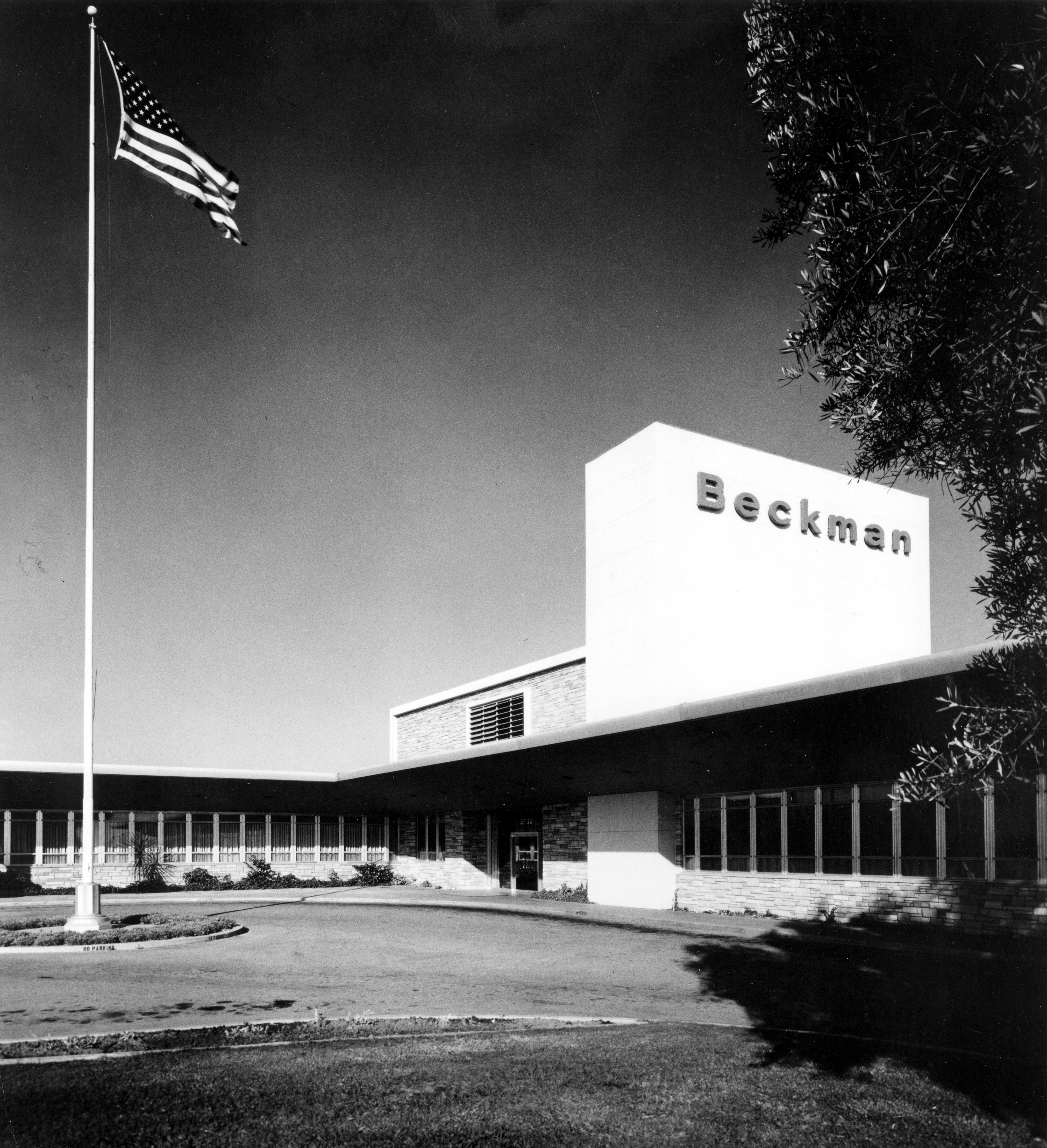A black and white photograph of the exterior of the Beckman Instruments administration offices.