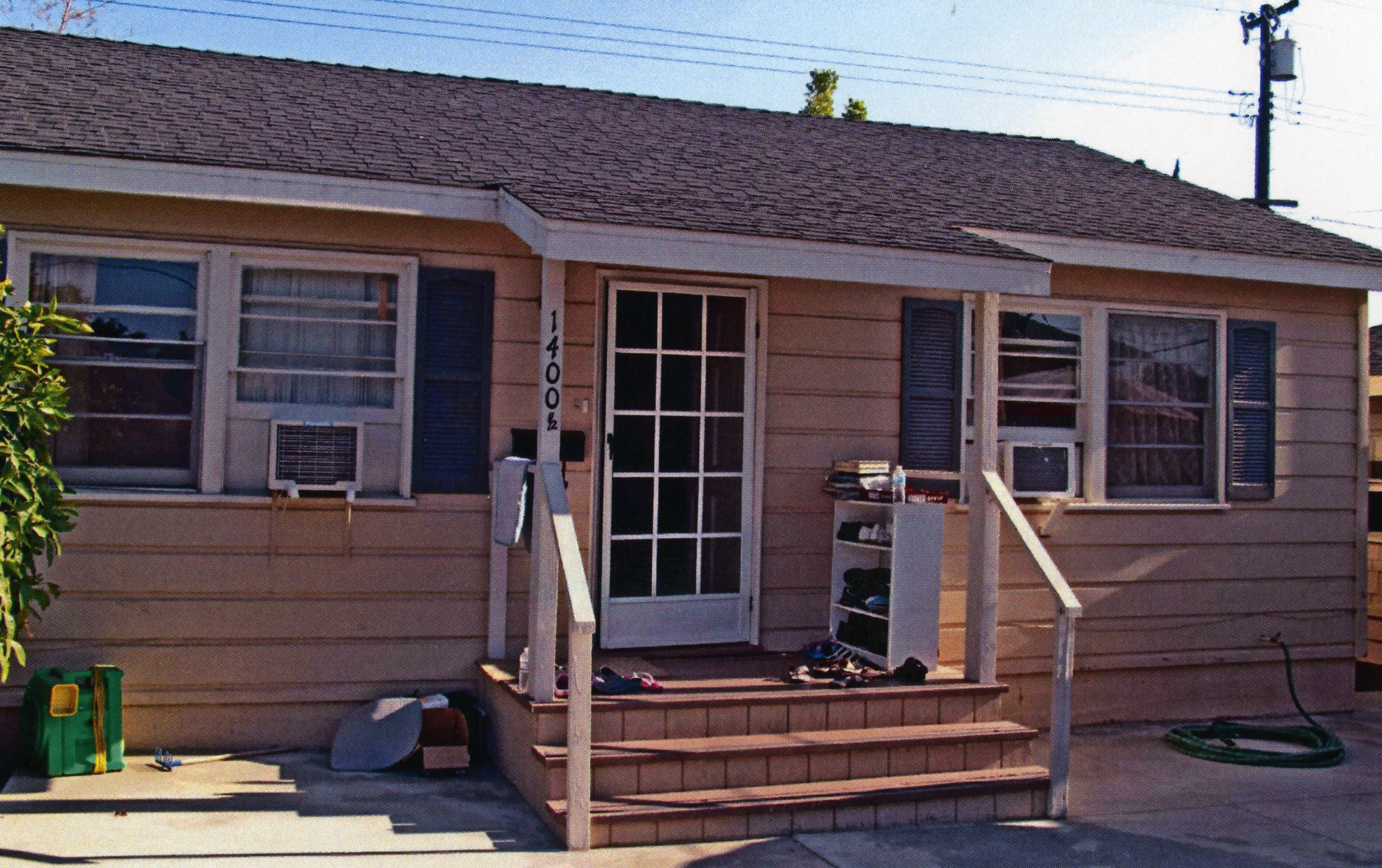 A colored photo of the guest residence for the Clarence Spencer House in 2013.