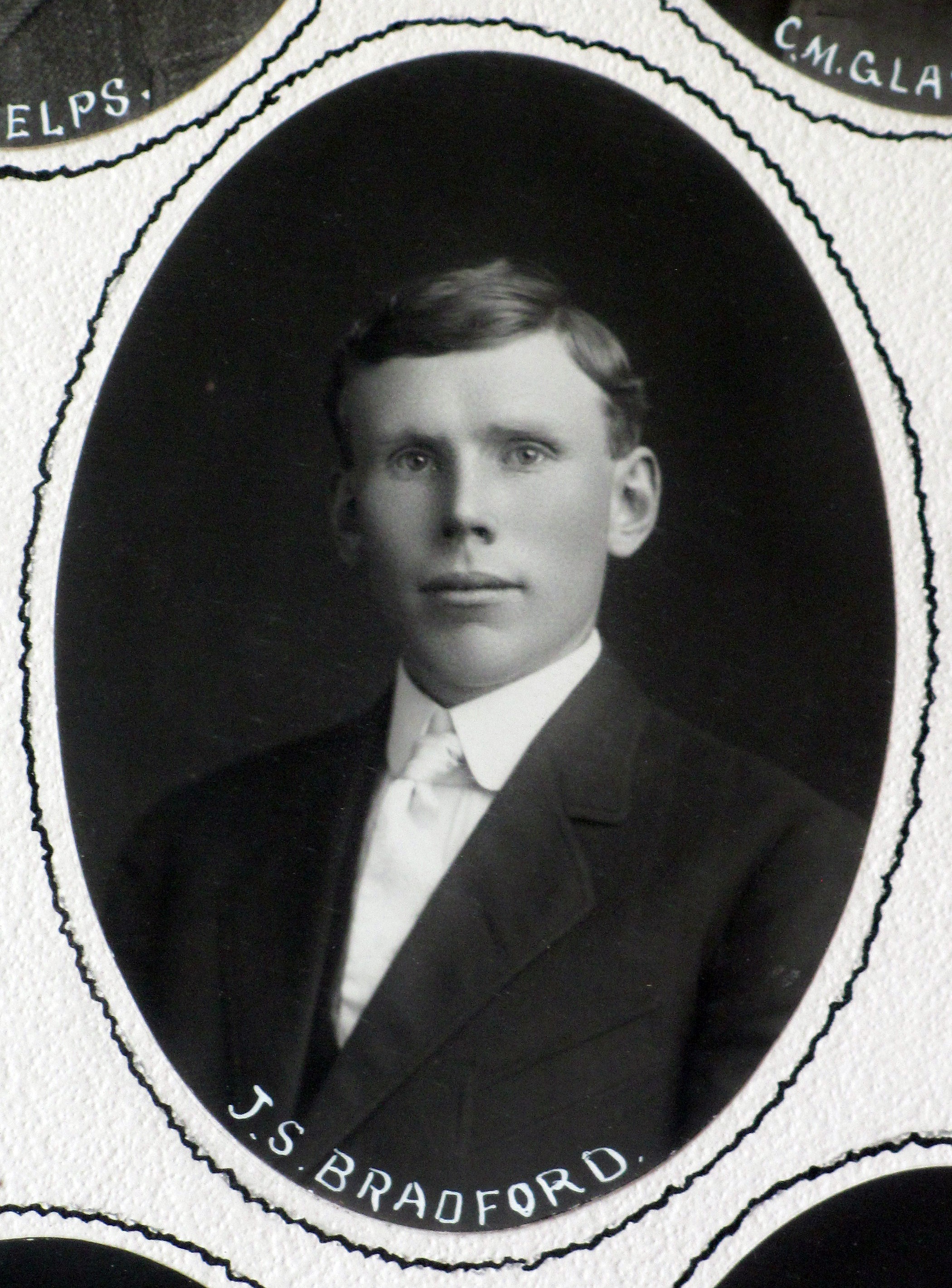 A black and white portrait photograph of Julius Bradford in 1910. The bottom of the photo reads: J.S. Bradford.