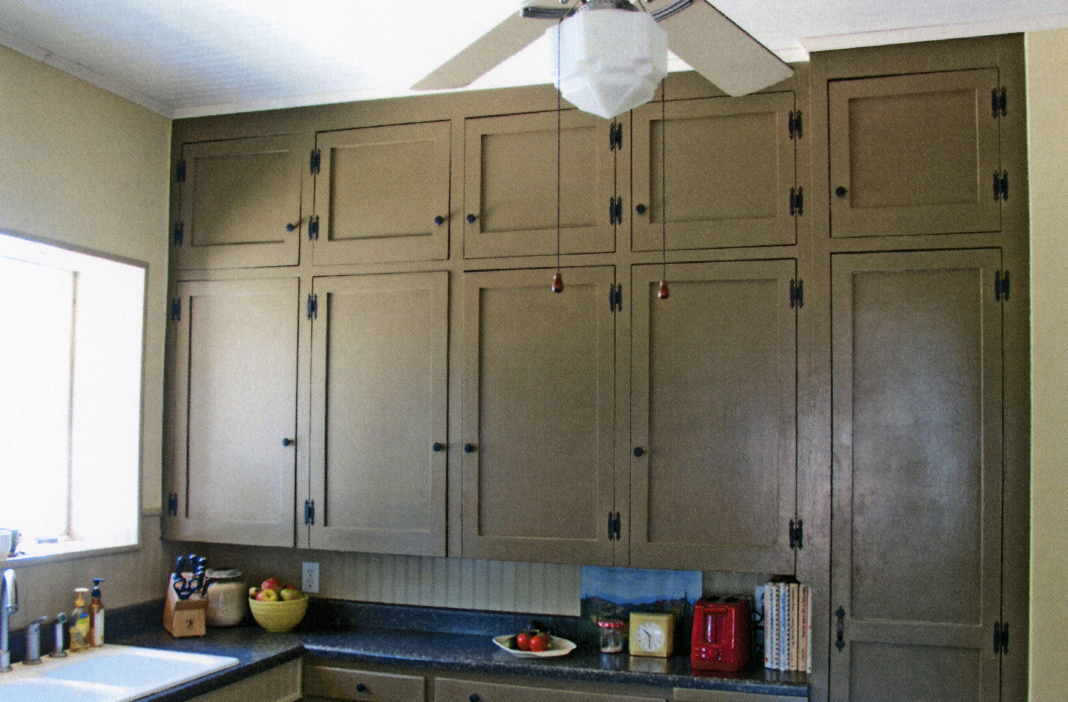 A colored photo of the original cabinetry in the kitchen of the Julius Bradford House in 2013.