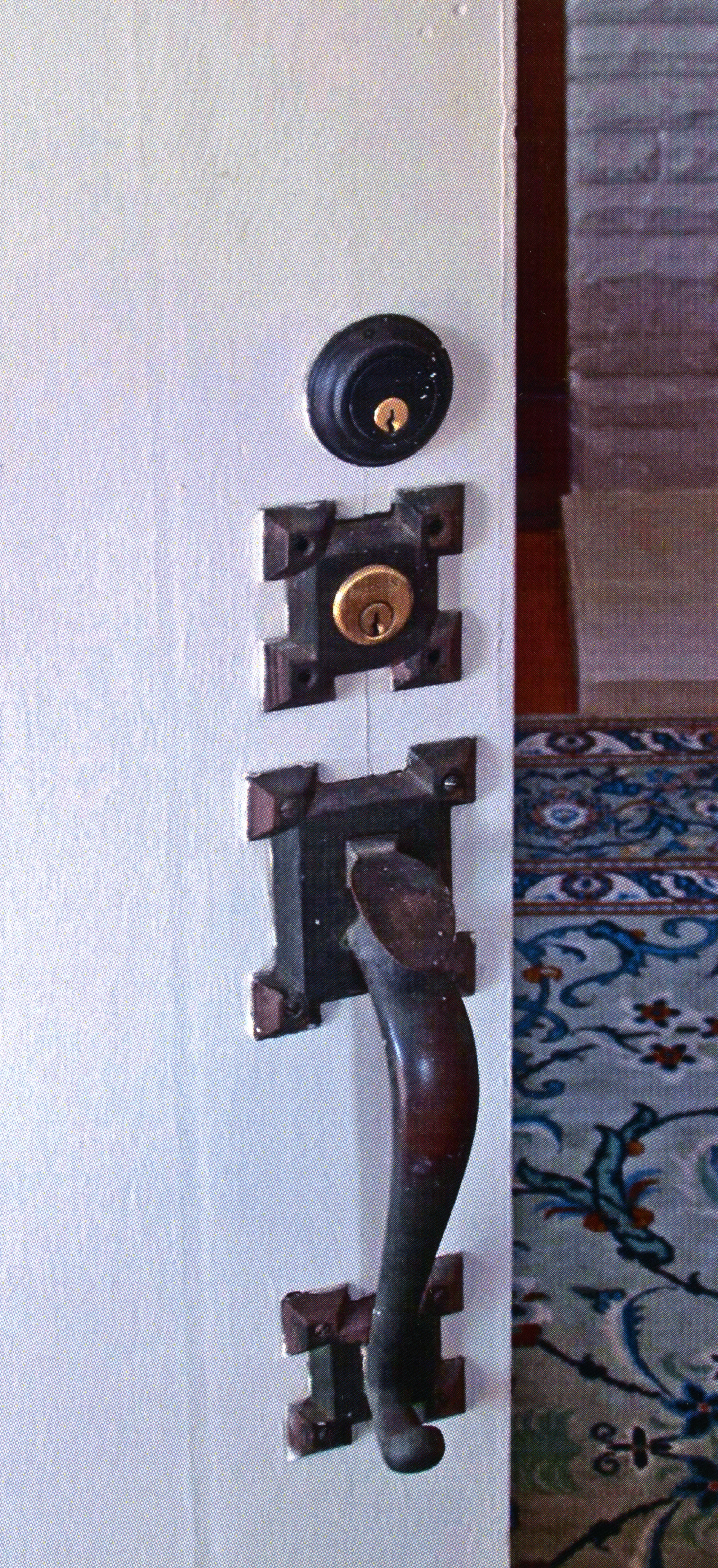 A colored photo of the original door hardware for the Clarence Spencer House in 2013.