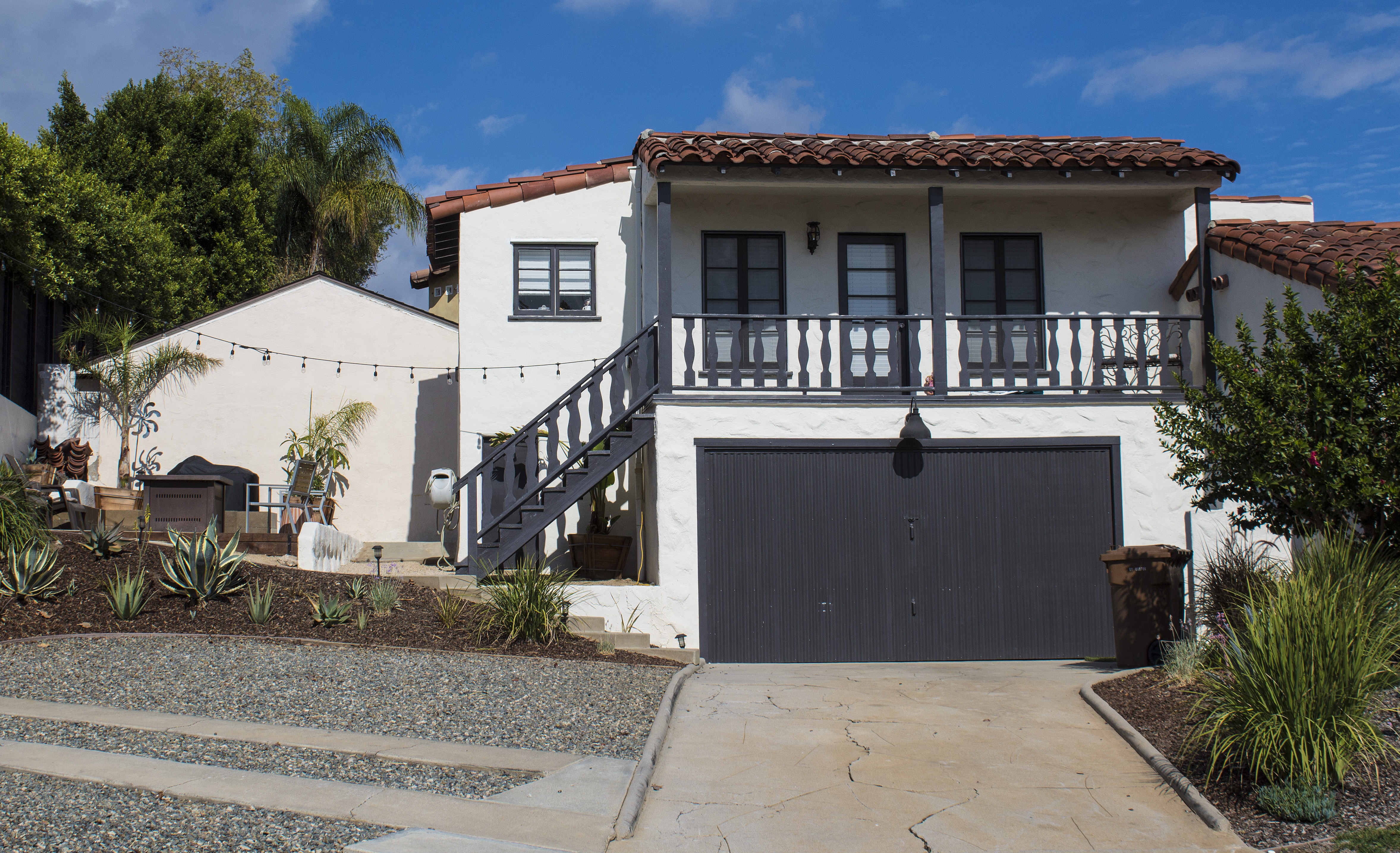 A colored photo of the attached garage with additional unit of the Otto Evans House in 2024.