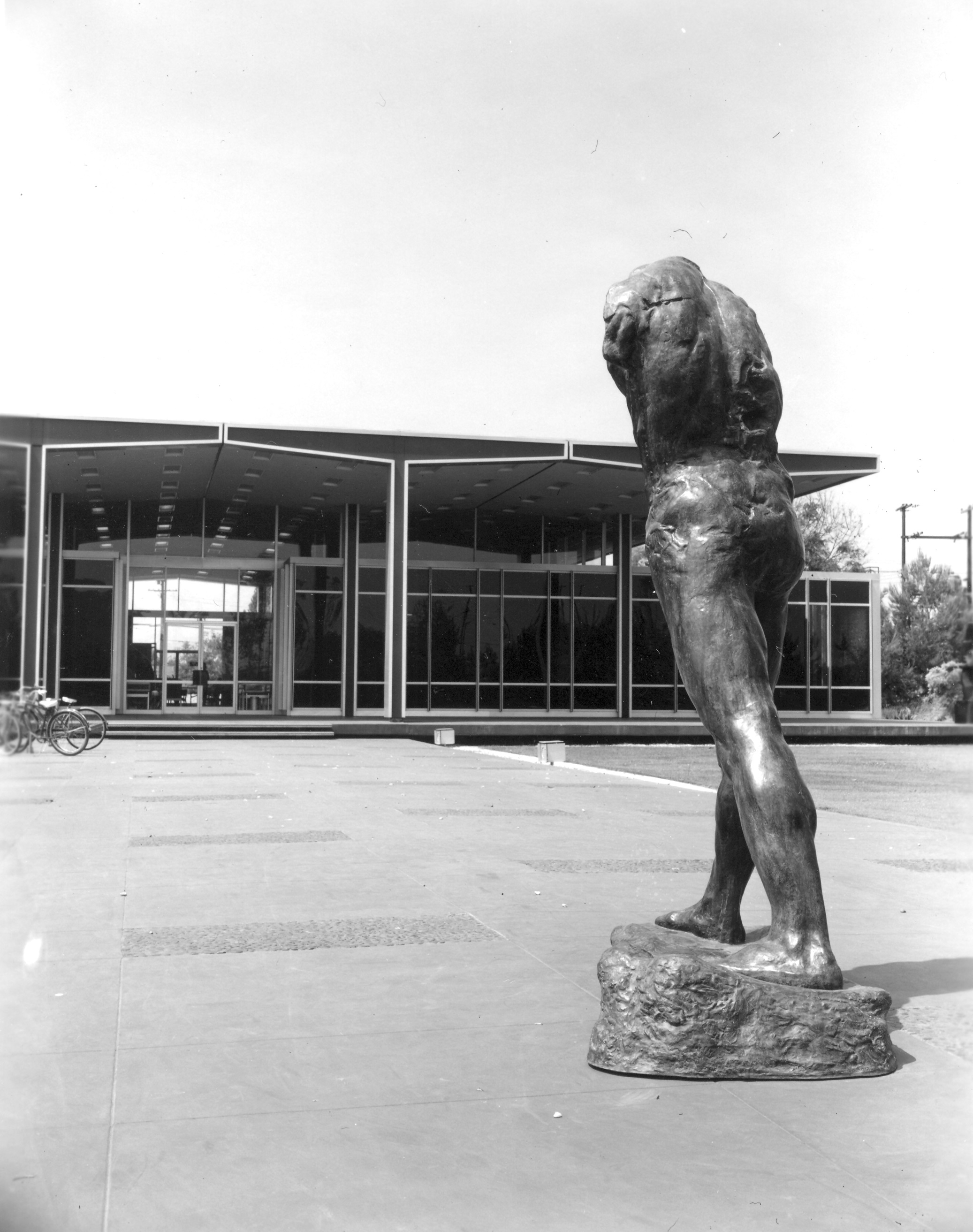 A black and white photograph of the Hunt Library with a sculpture located outside of the building.
