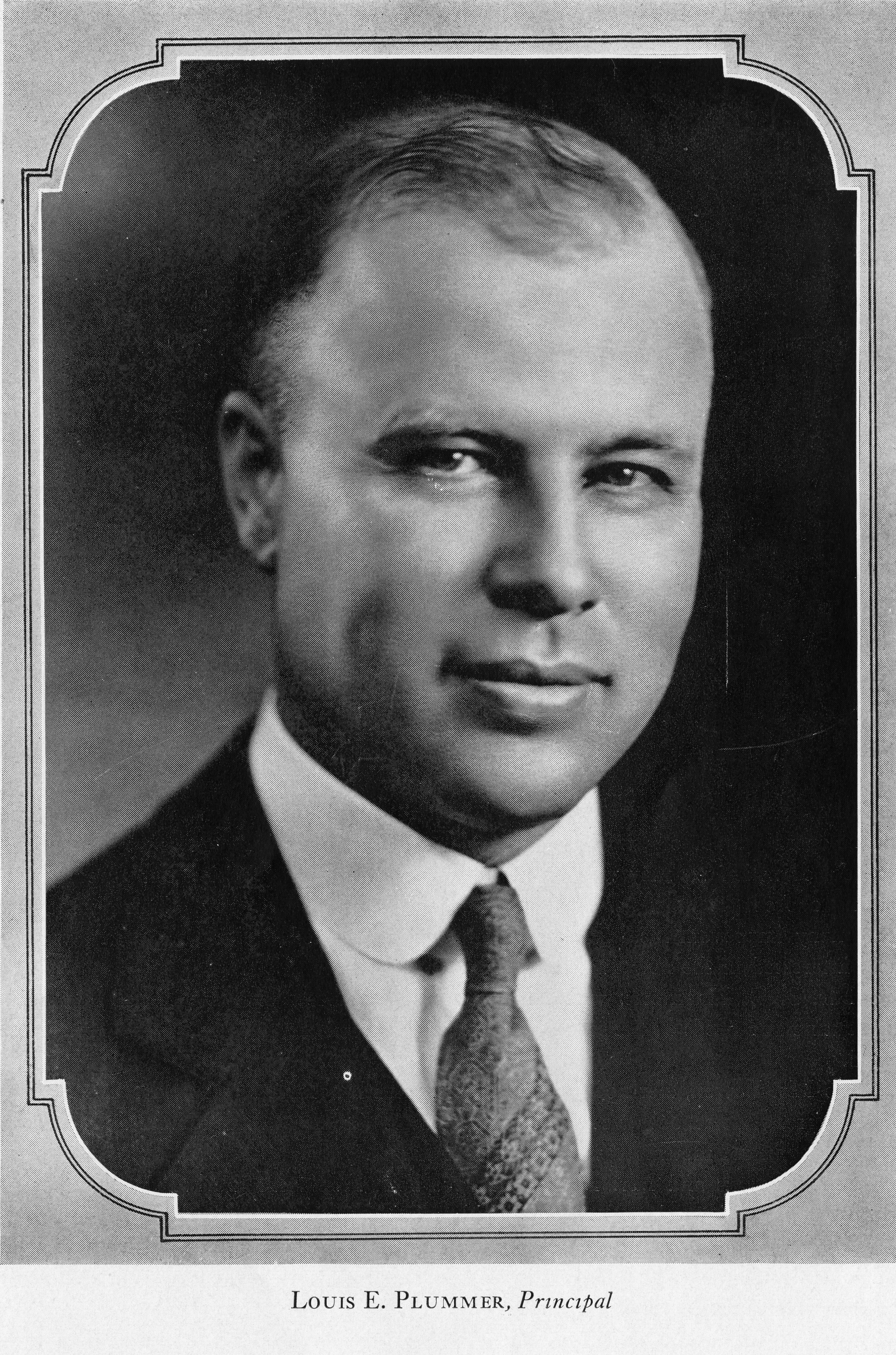 A black and white portrait photograph of Louis Plummer in 1929. The bottom of the photo reads: Louis E. Plummer, Principal.