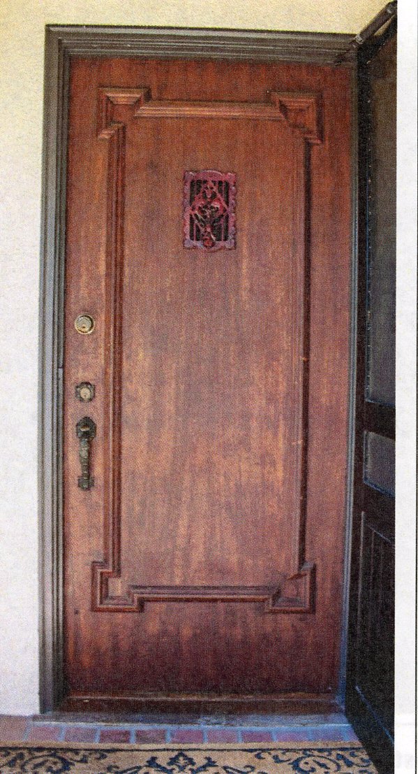 A colored photo of the original front door of the William N. Rollo House in 2024.