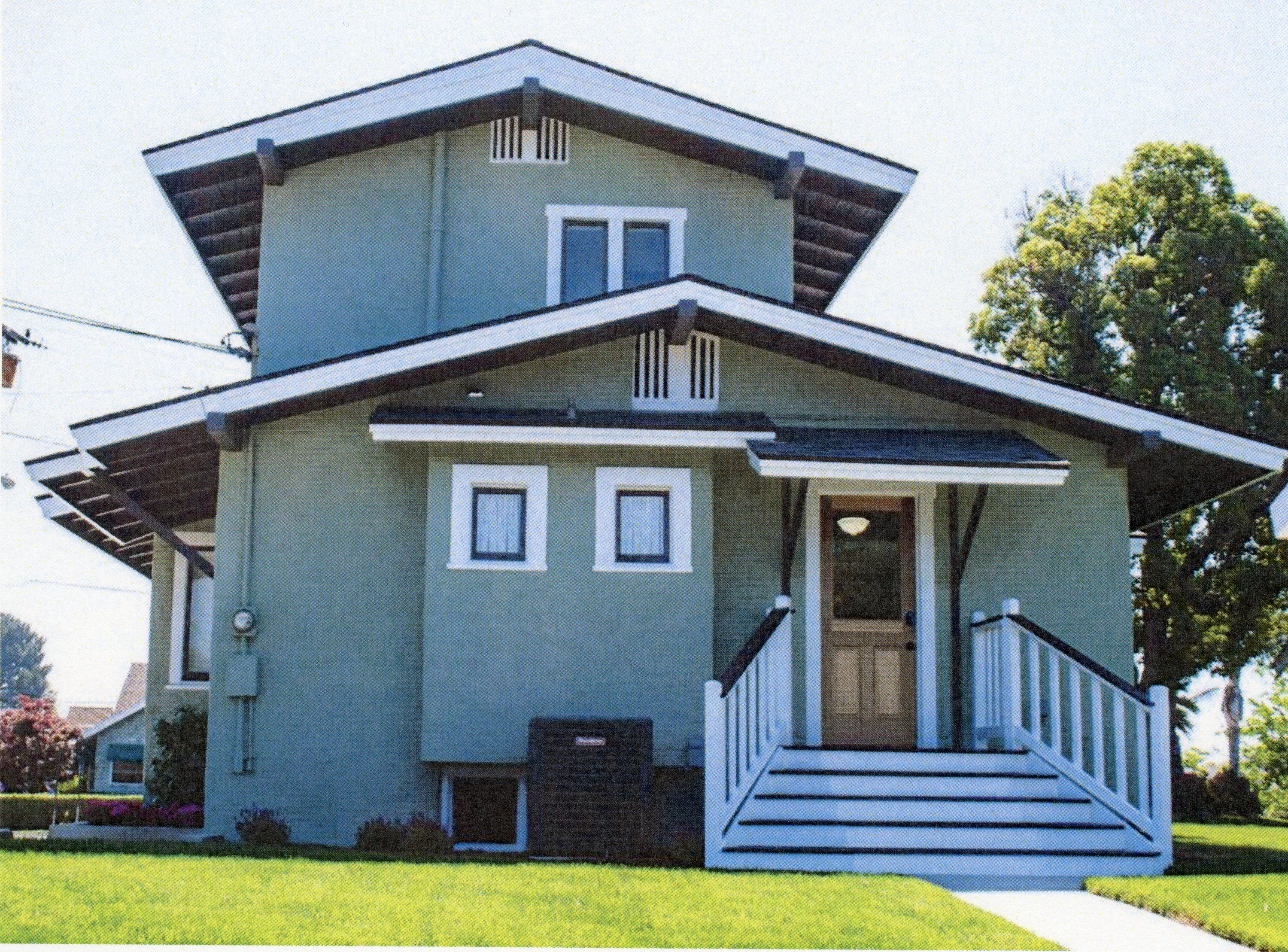 A colored photo of the rear exterior of the Louis Plummer House in 2024.