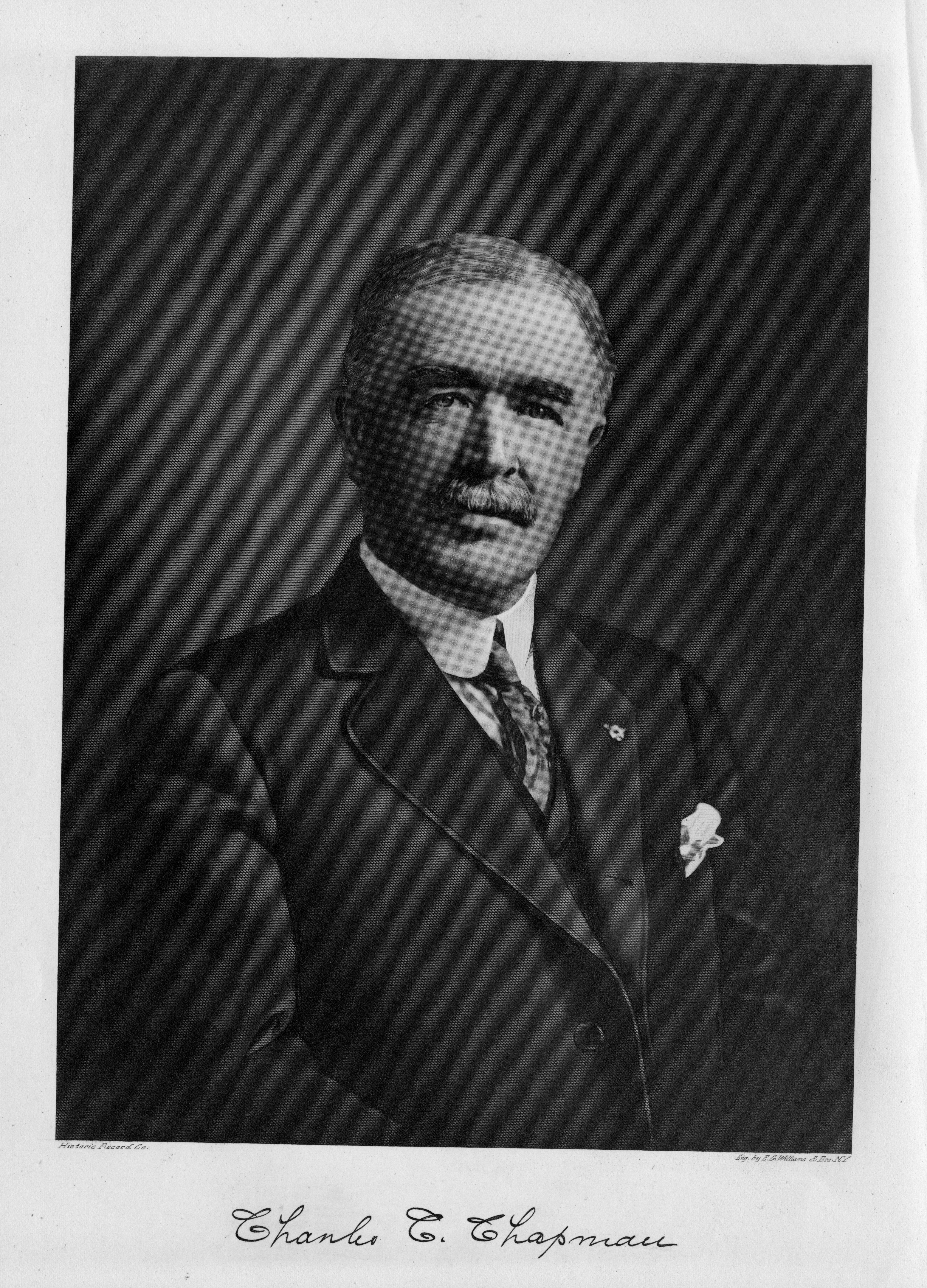 A black and white portrait photograph of Charles Chapman. The bottom of the photo reads: Charles C. Chapman.