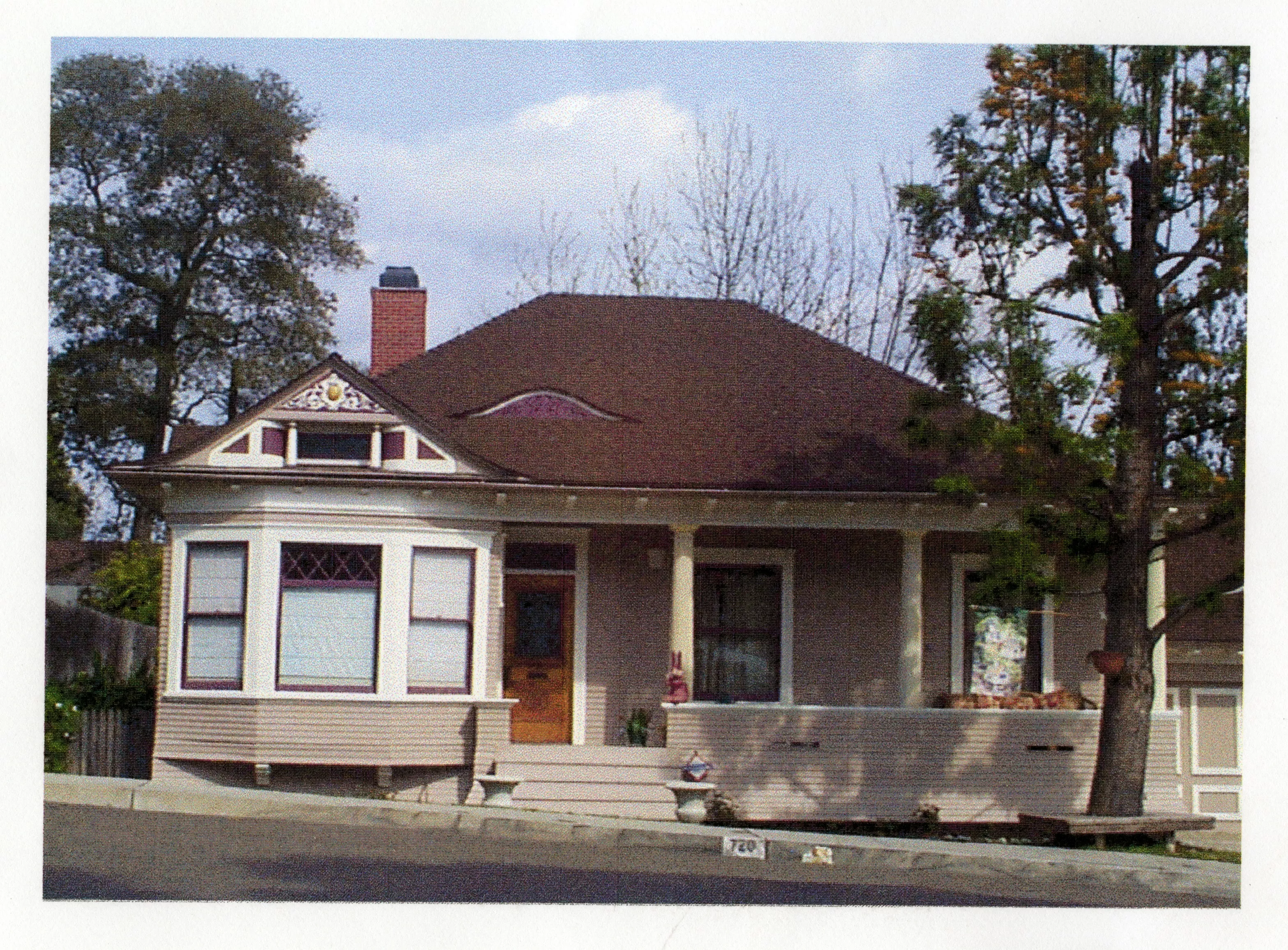 A colored photo of the Ben Dauser House at its Barris Drive location in 2000.