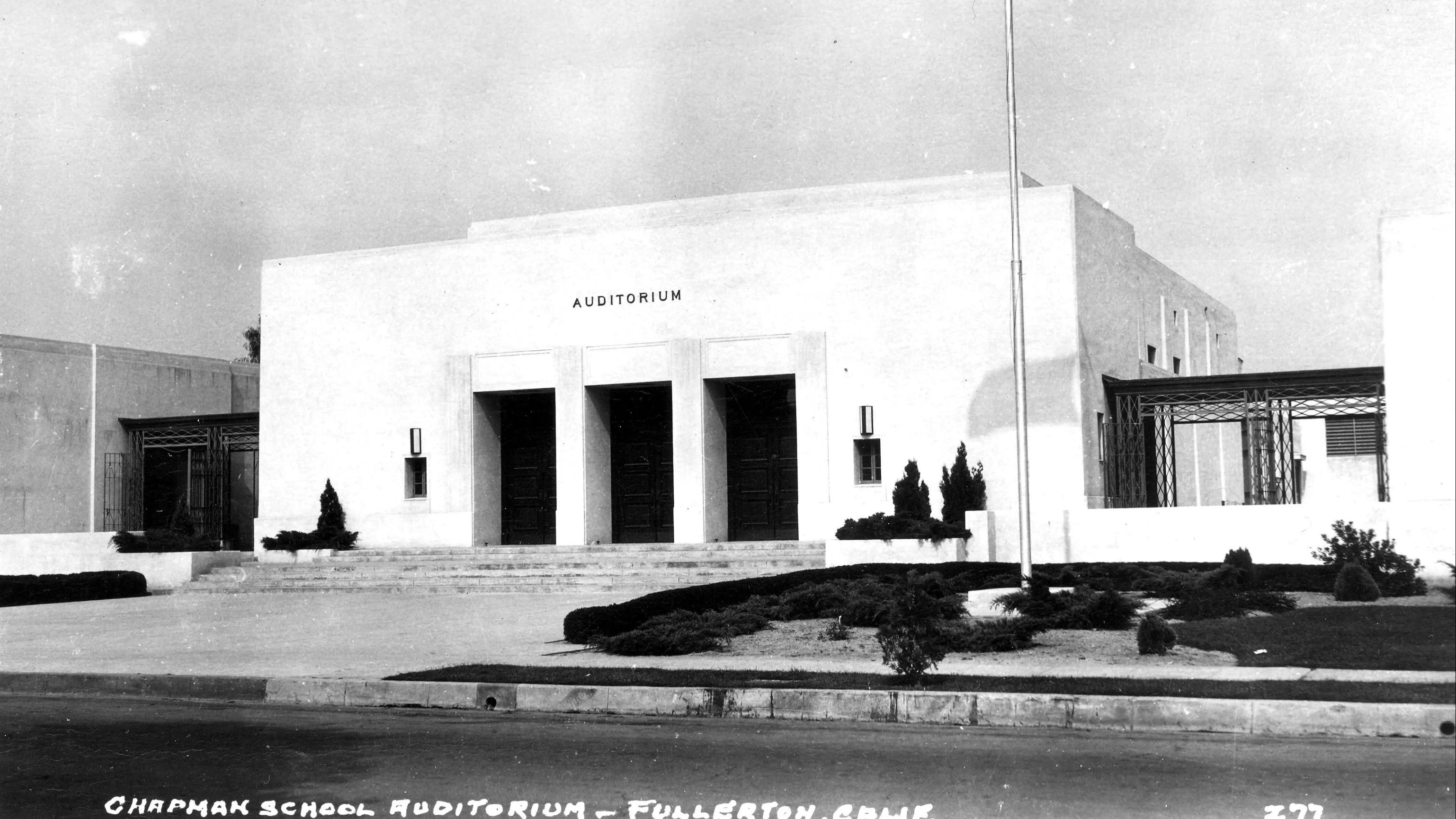 A black and white photograph of the early exterior of Wilshire Auditorium.