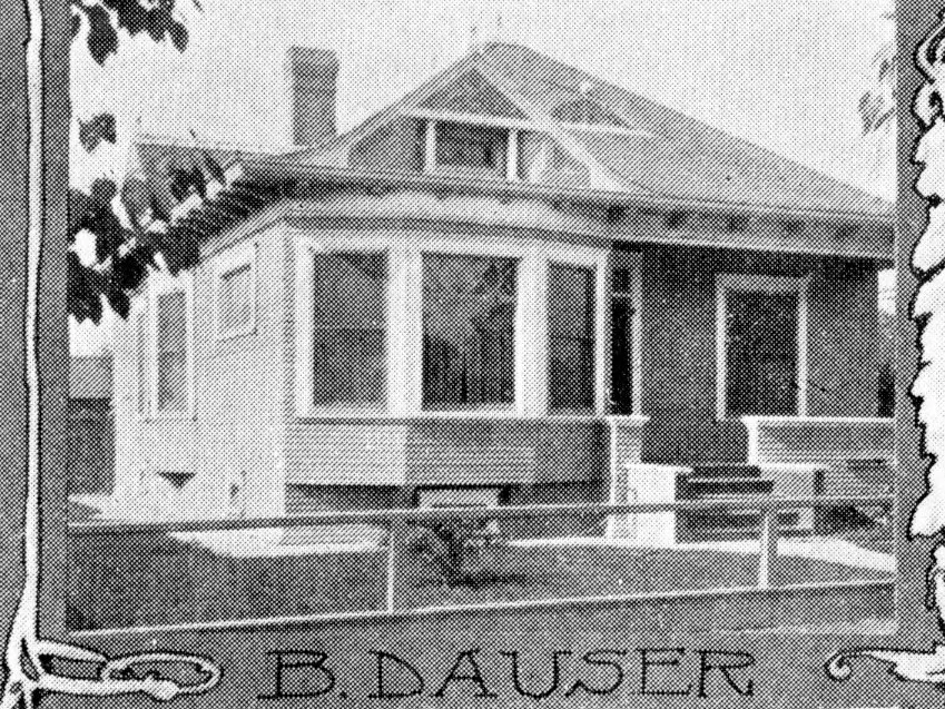 A black and white photograph of the exterior of the Ben Dauser House in 1904.