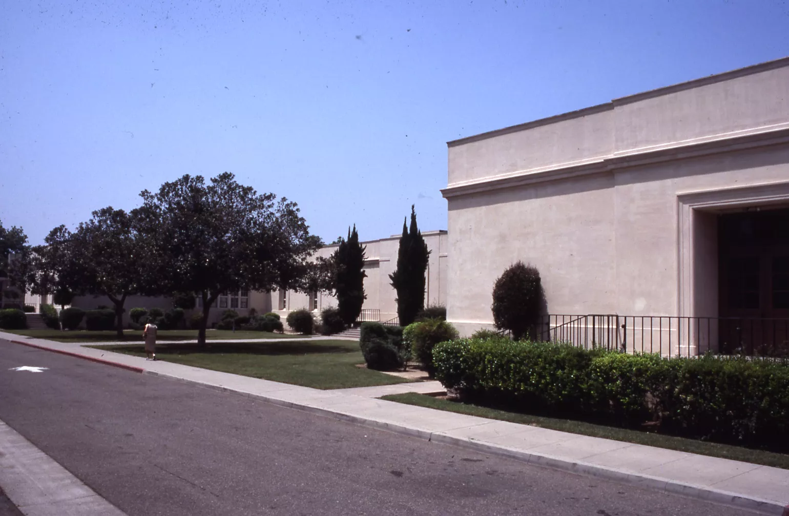 A colored photo of the front exterior of Ford Elementary School in 1979.