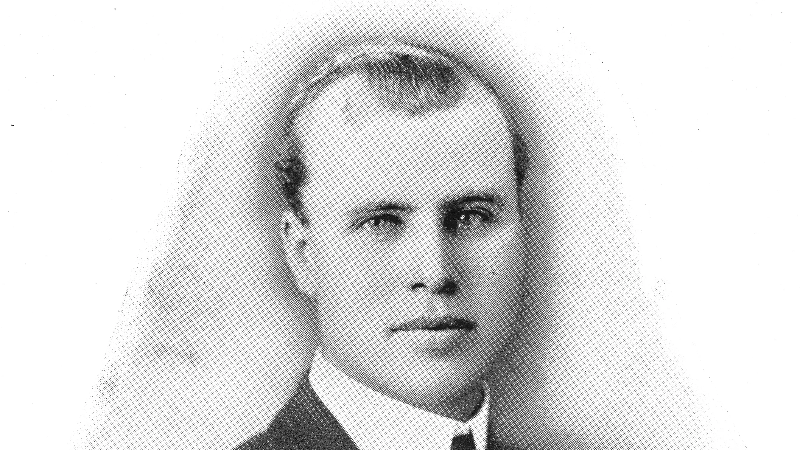 A black and white portrait of Louis Plummer in 1920.
