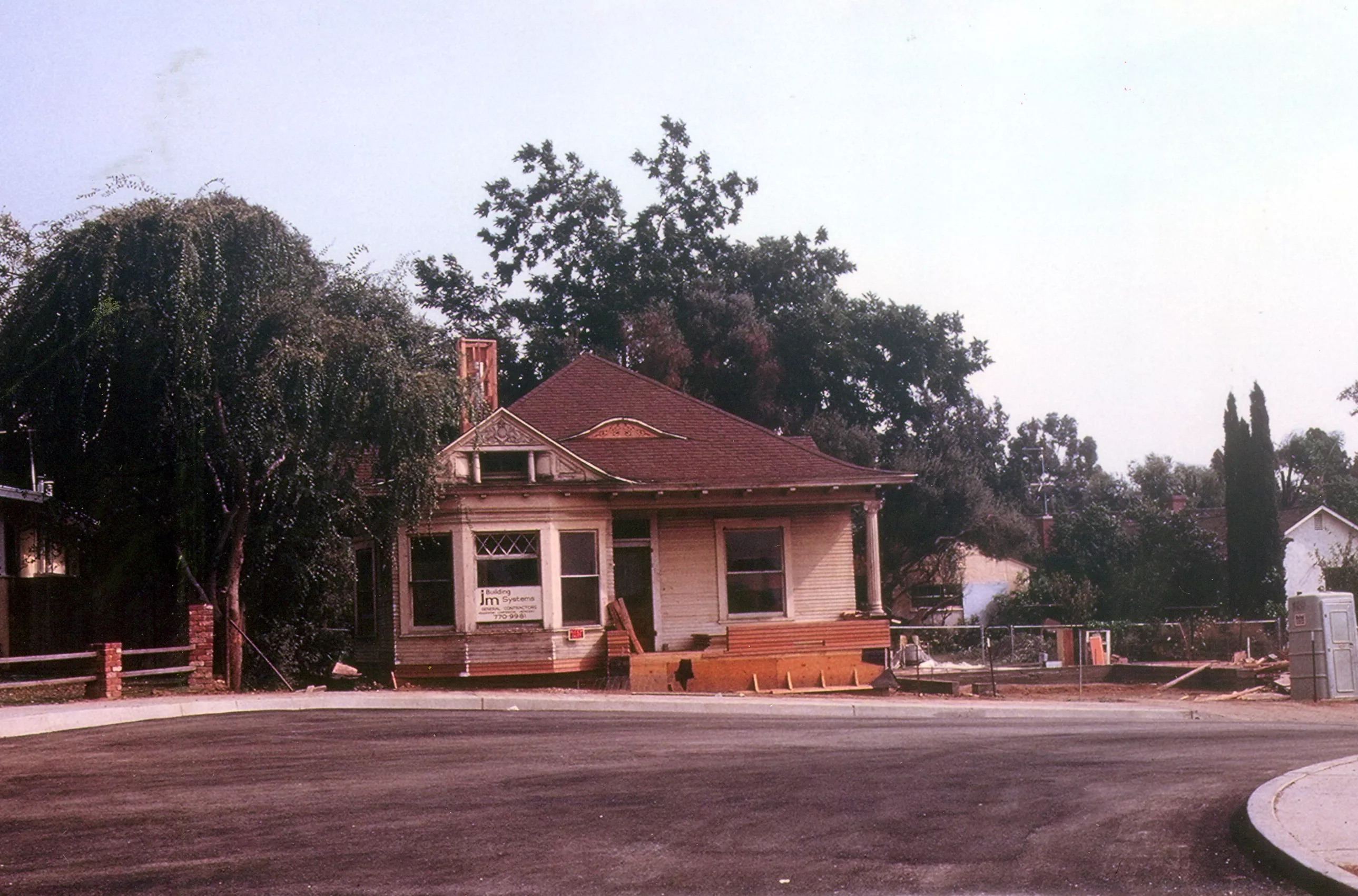 A colored photo of the Ben Dauser House after it had been moved to its Barris Drive location in 1982.