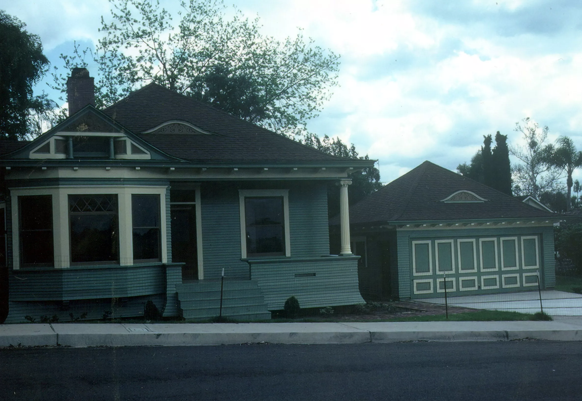 A colored photo of the Ben Dauser House&#039;s remodel with a newly added garage in 1982.