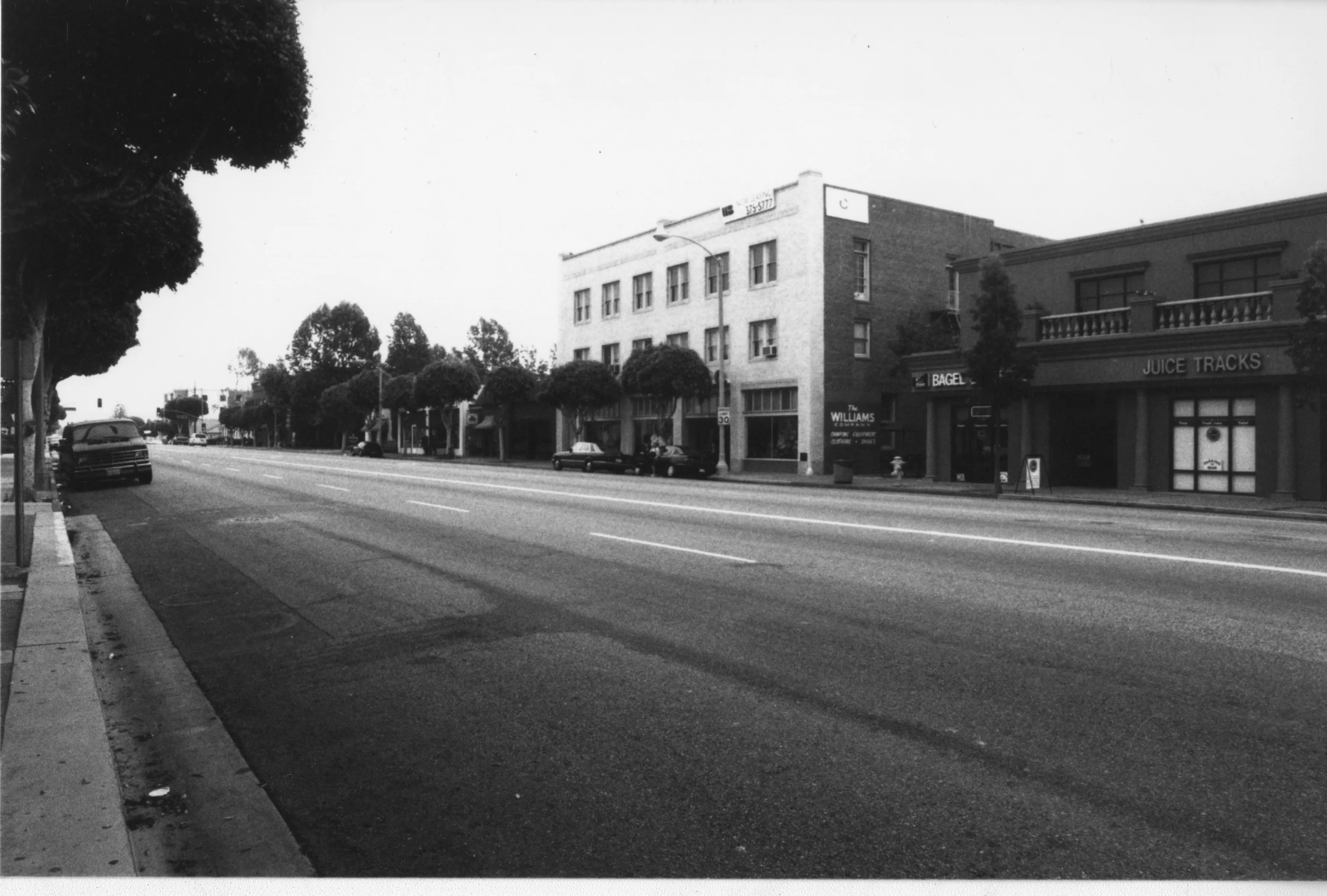 A black and white photograph of a street scene of the Odd Fellows Temple taken in 2001.