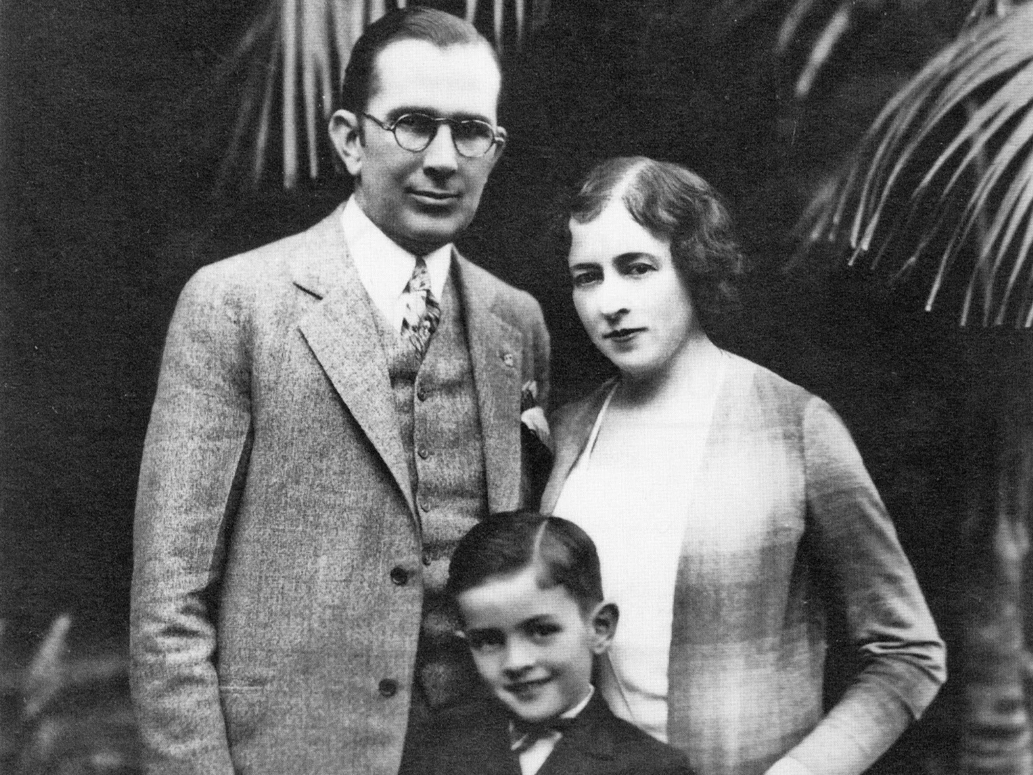 A black and white portrait of the Muckenthaler family. Walter (left), Adella (right), and Harold Mucklenthaler (middle).